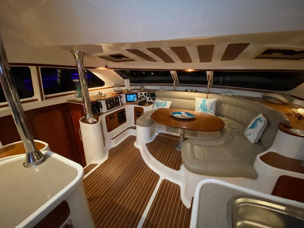 Luxurious interior of 2013 Africat Marine AfriCat PowerCat Sportfisher with plush seating and modern amenities.