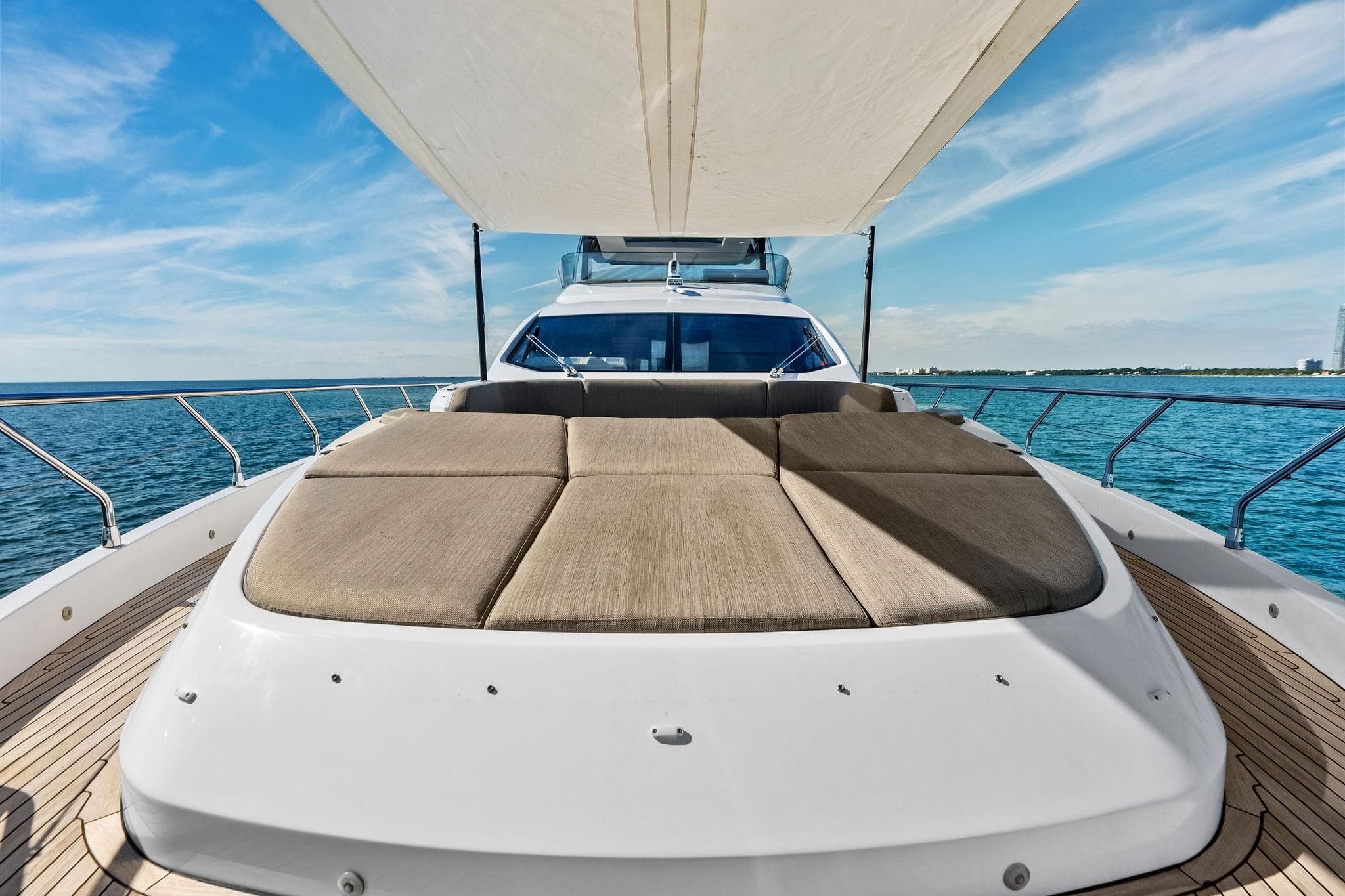 Luxurious 2021 Azimut Fly 78 yacht with spacious sun deck and ocean view.