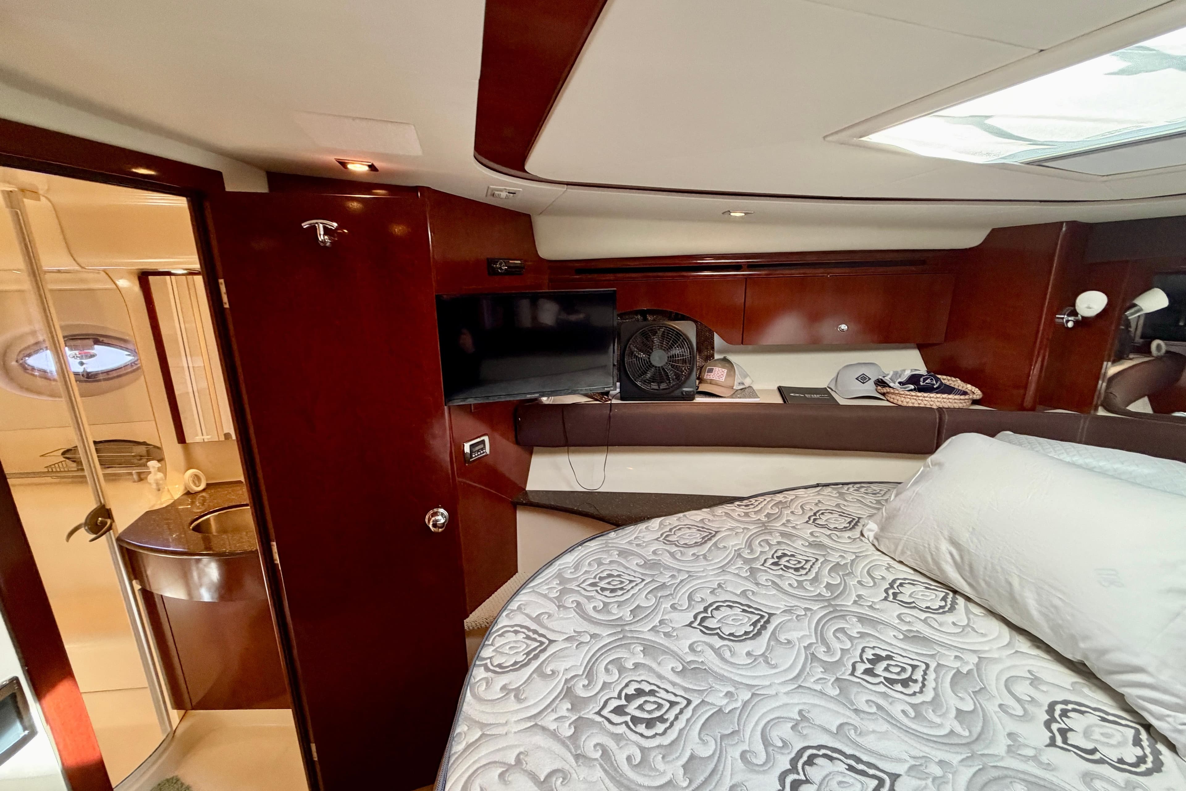 Luxurious interior of a 2011 Meridian 441 Sedan yacht with elegant wood finishes.