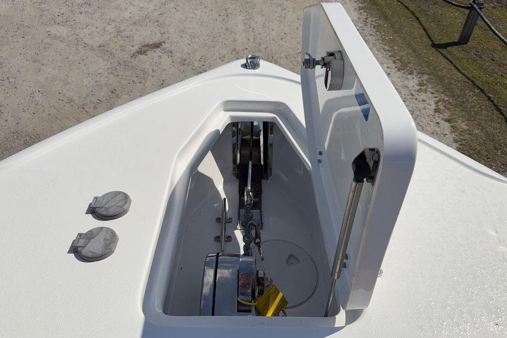 2024 Sea Hunt Ultra 265 SE anchor locker with open hatch on deck.