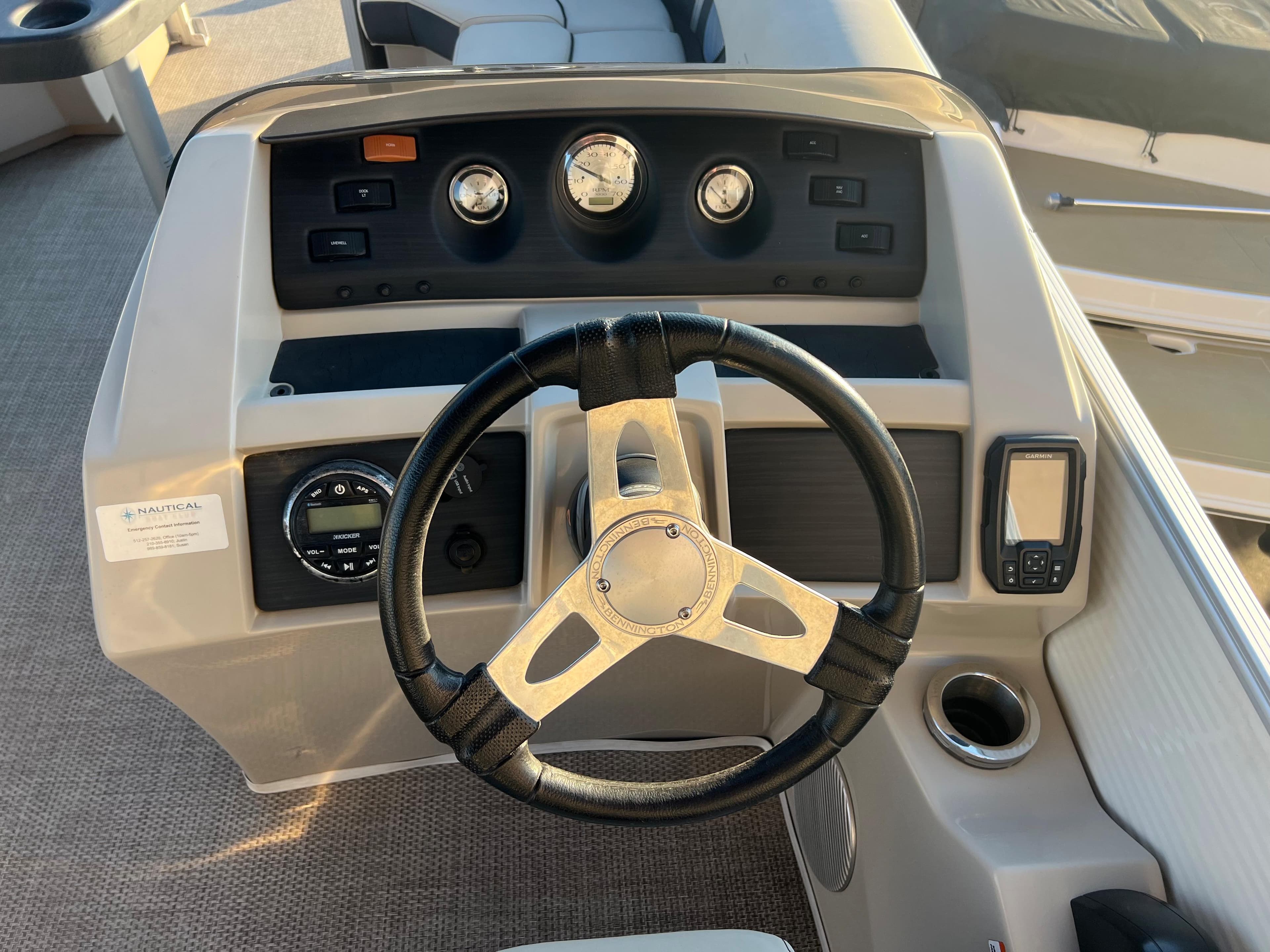 2019 Bennington 22 SSRX boat dashboard with steering wheel and control panel.