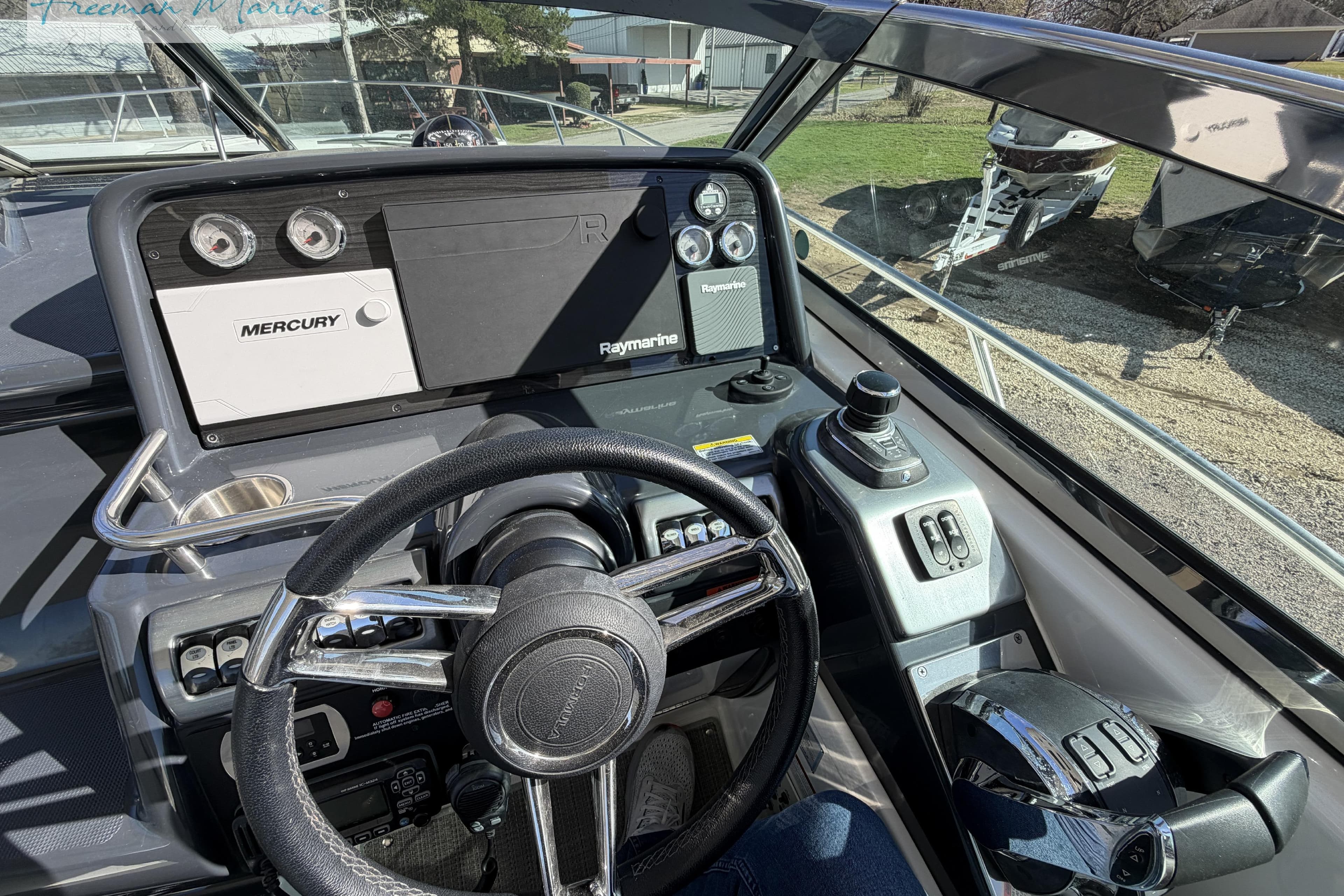 2018 Formula 34 Performance Cruiser cockpit with steering wheel and control panel.
