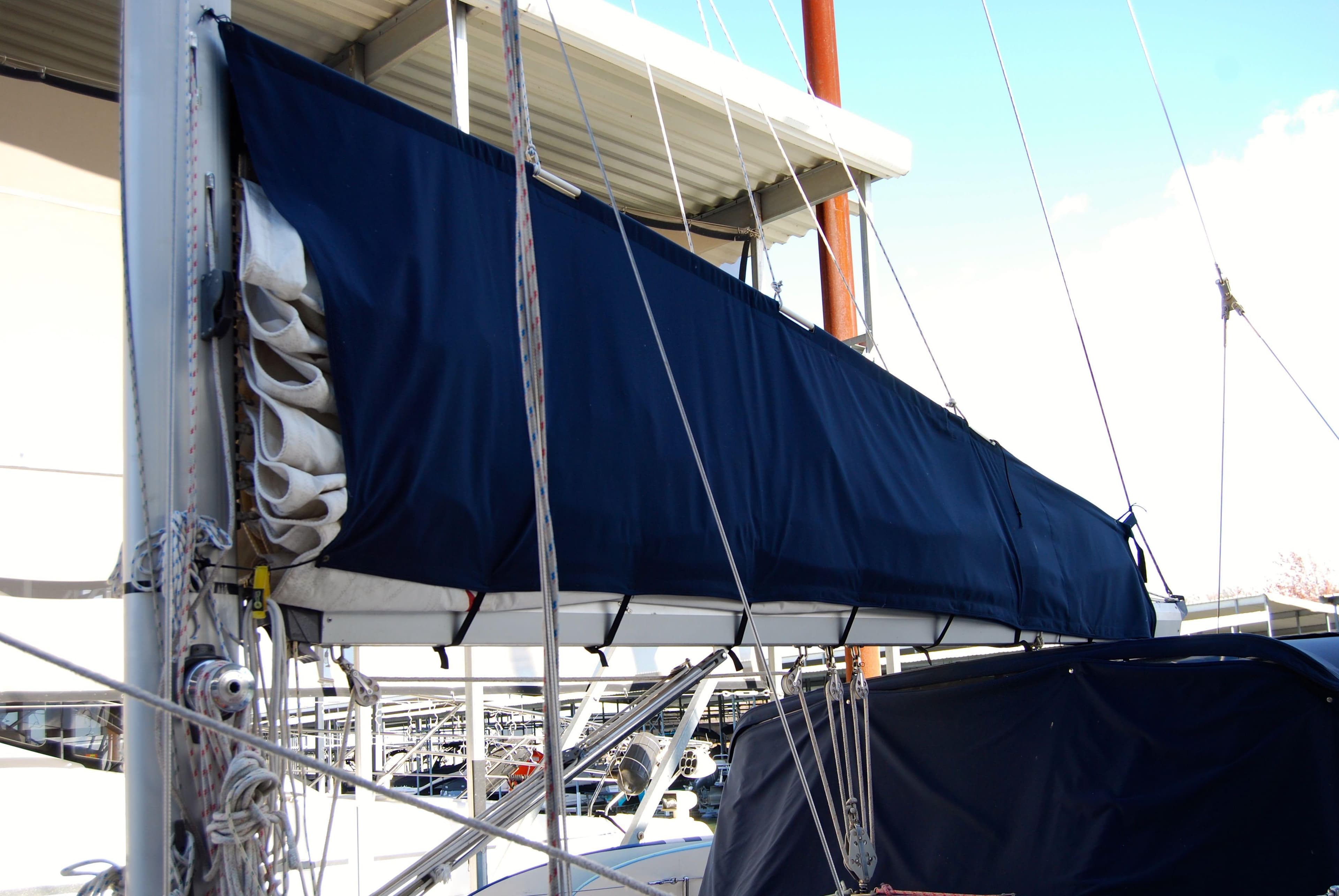 1985 Endeavour 38 sailboat with blue sail cover and rigging details.