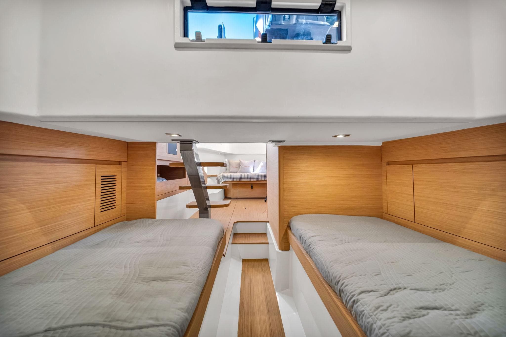 Cabin interior of 2021 Pardo Yachts 38 with twin beds and wooden finish.