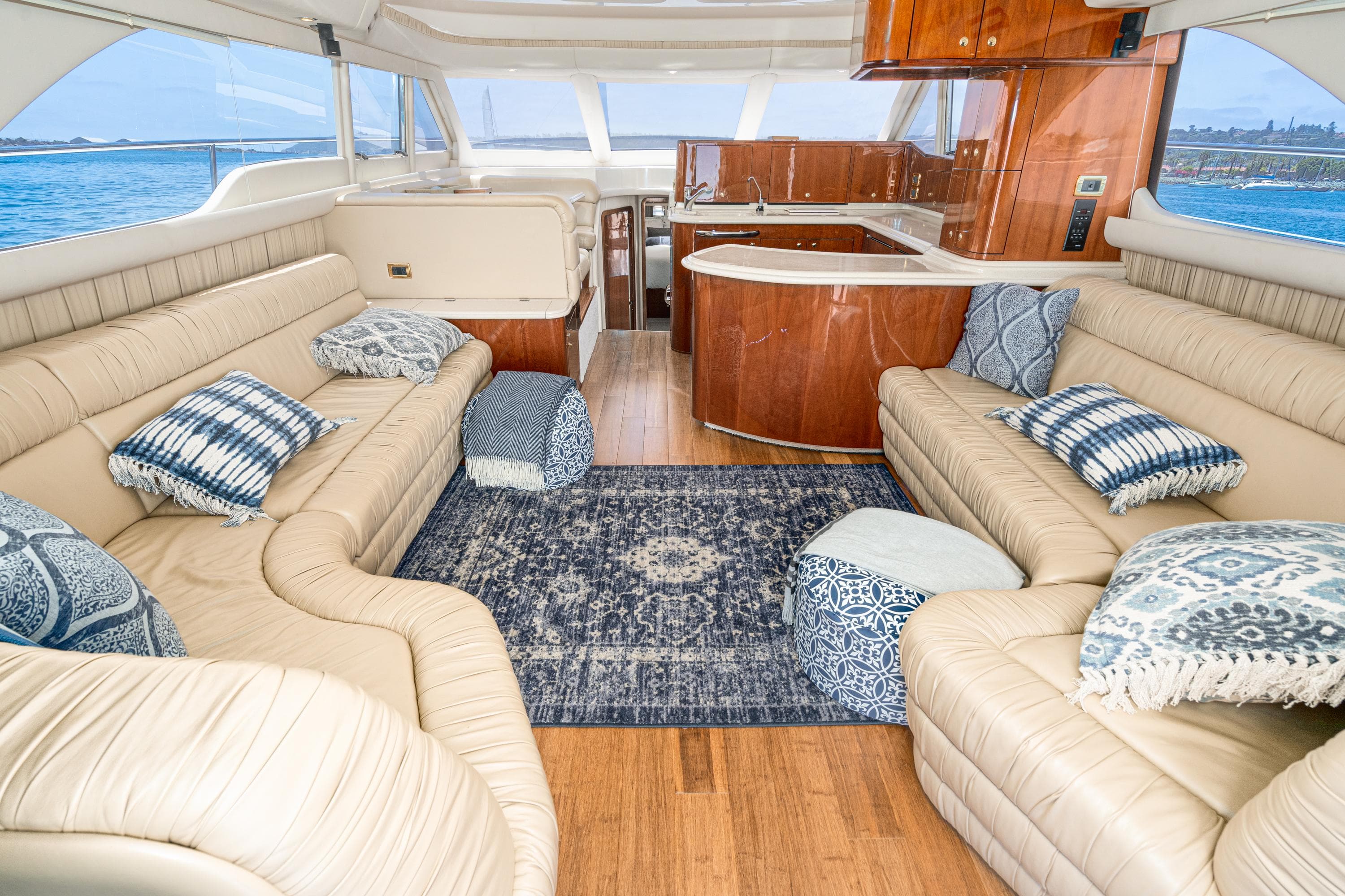 Luxurious interior of 2001 Sea Ray 560 Sedan Bridge yacht with plush seating and elegant decor.
