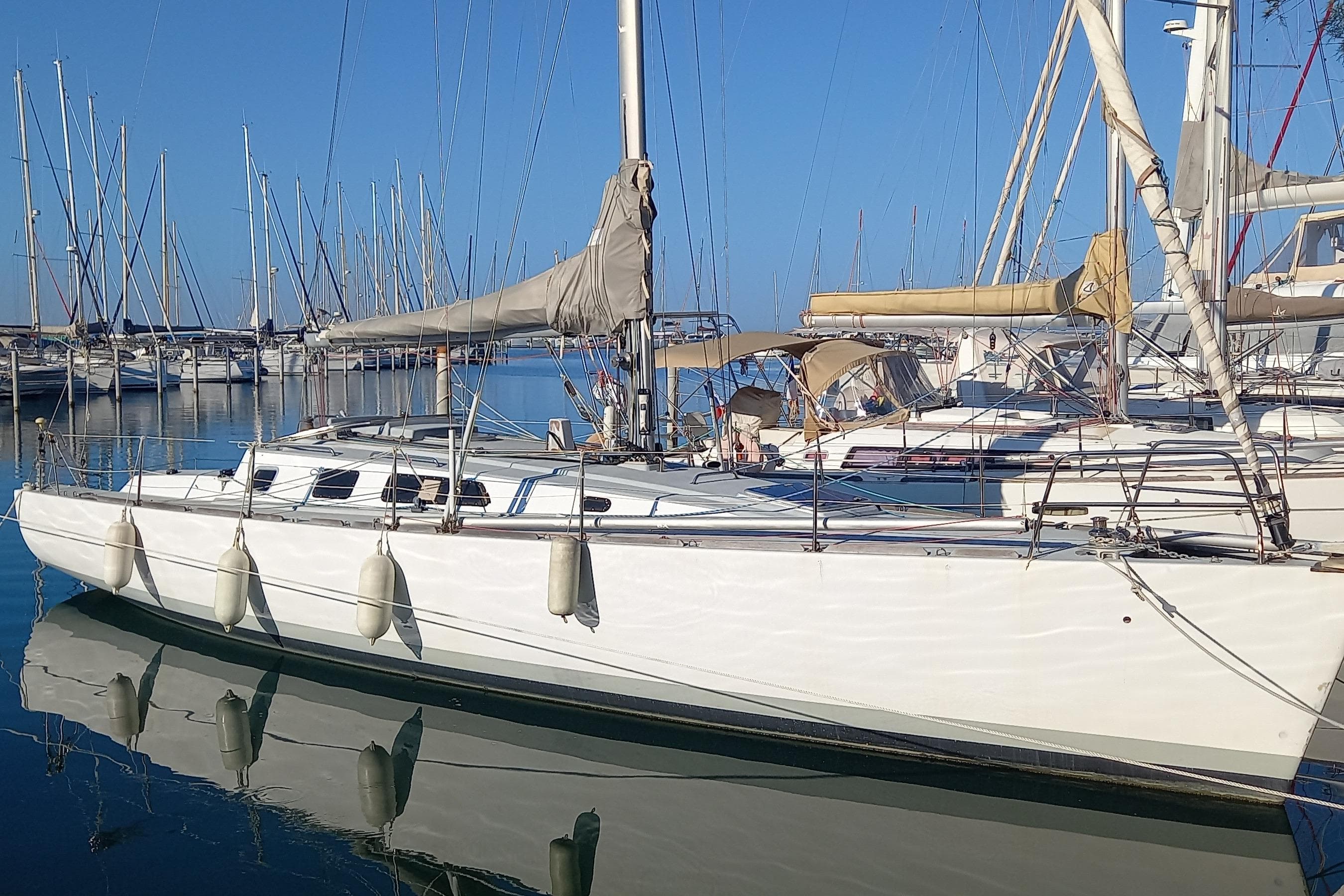 Sailboat in marina, DanielP1Tester One-Off Design, 2012, with clear blue sky.