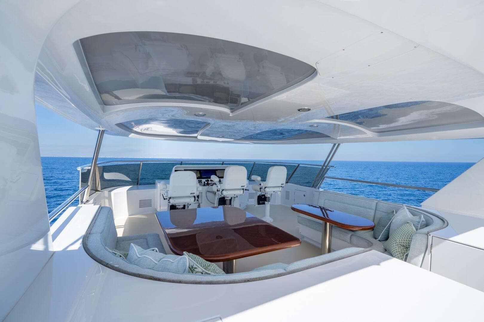 Luxurious 2001 Delta Marine Tri-Deck yacht with elegant seating and ocean view.