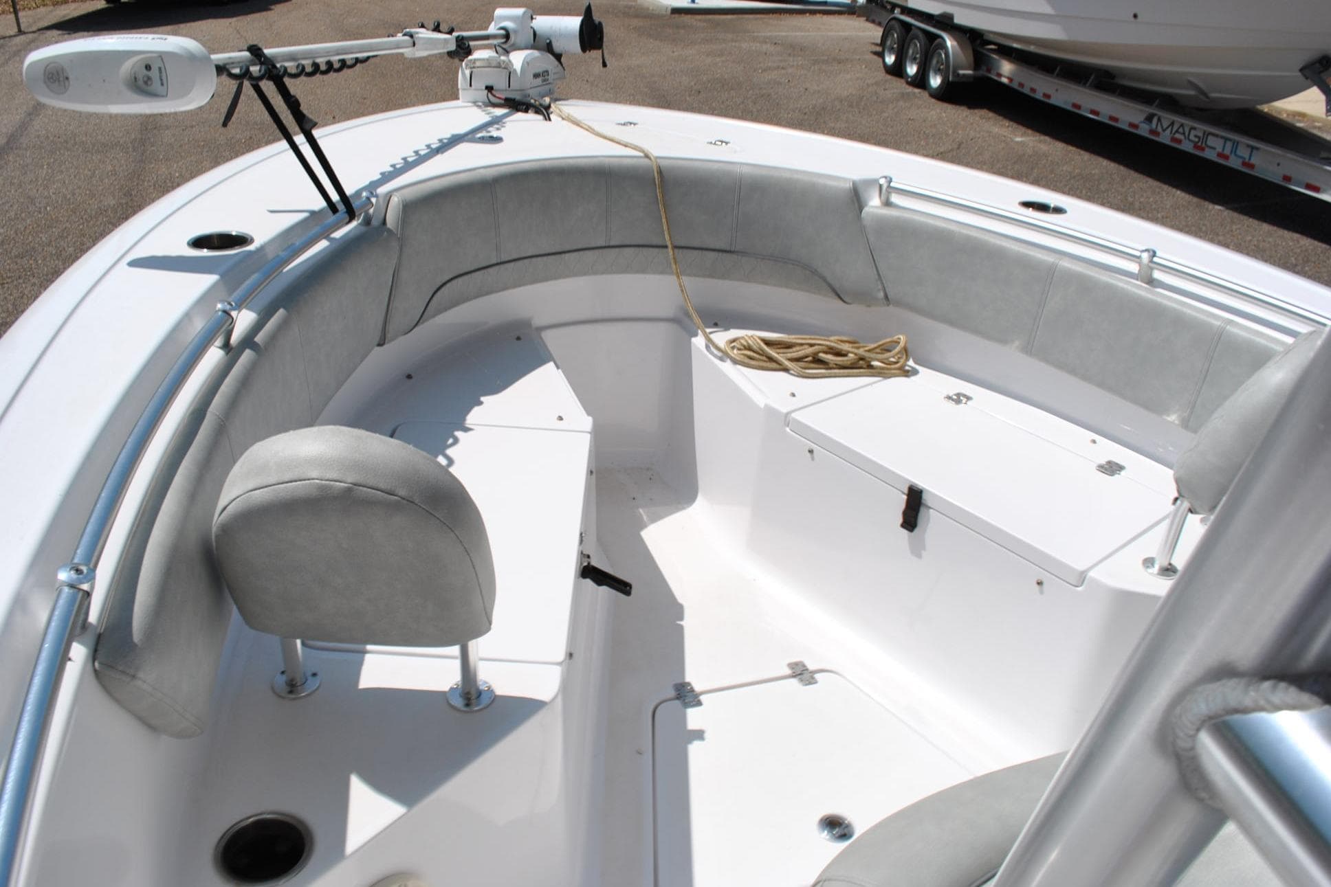 2020 Sportsman Open 232 Center Console boat interior with seating and storage.