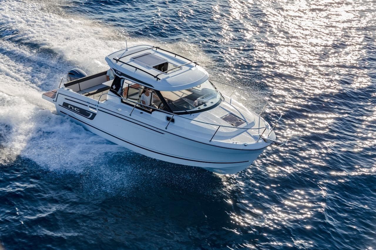 2025 Jeanneau NC 795 Series 2 cruising on sparkling blue water.