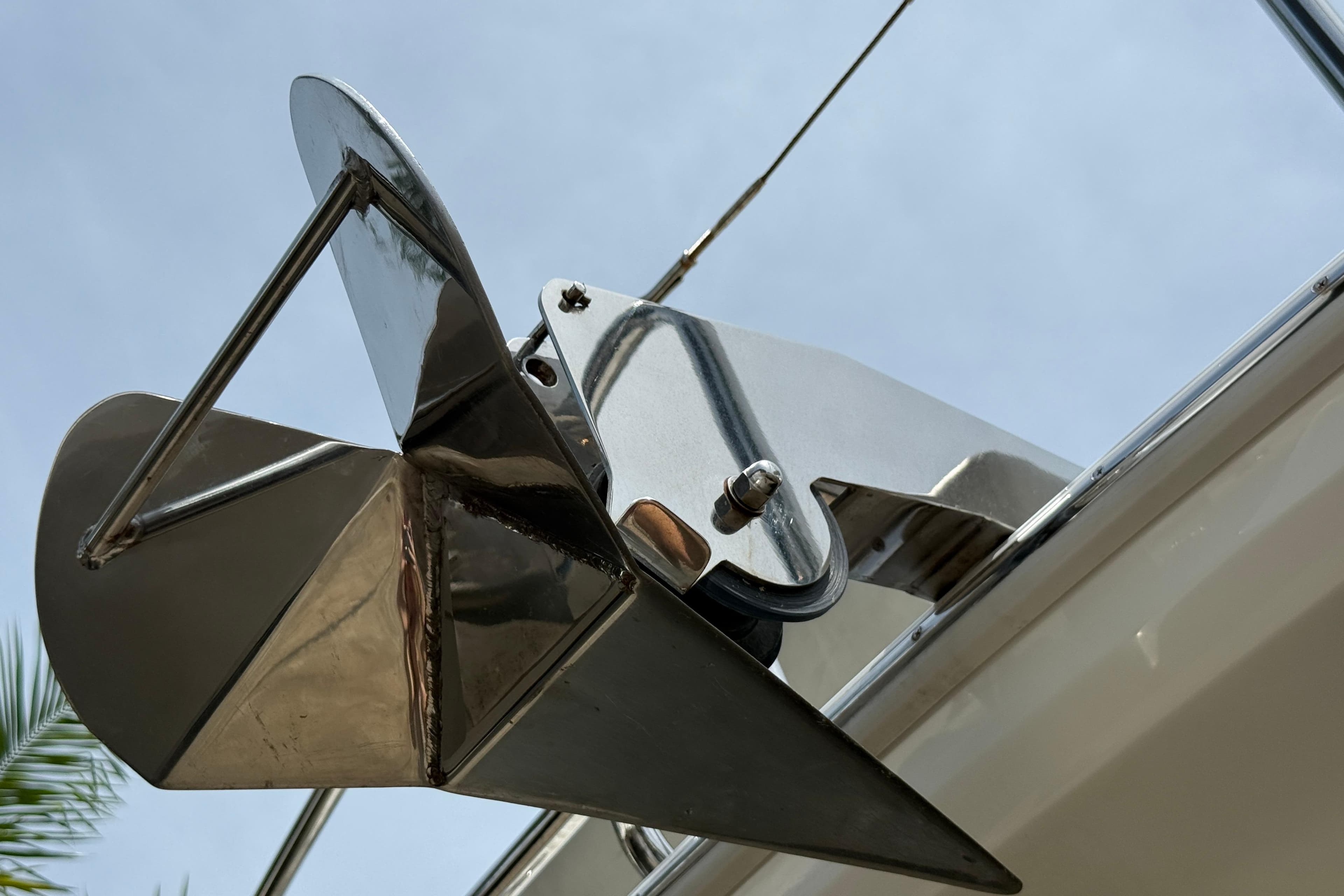 Close-up of a 2021 Aquila 36 Sport boat anchor against a clear sky.