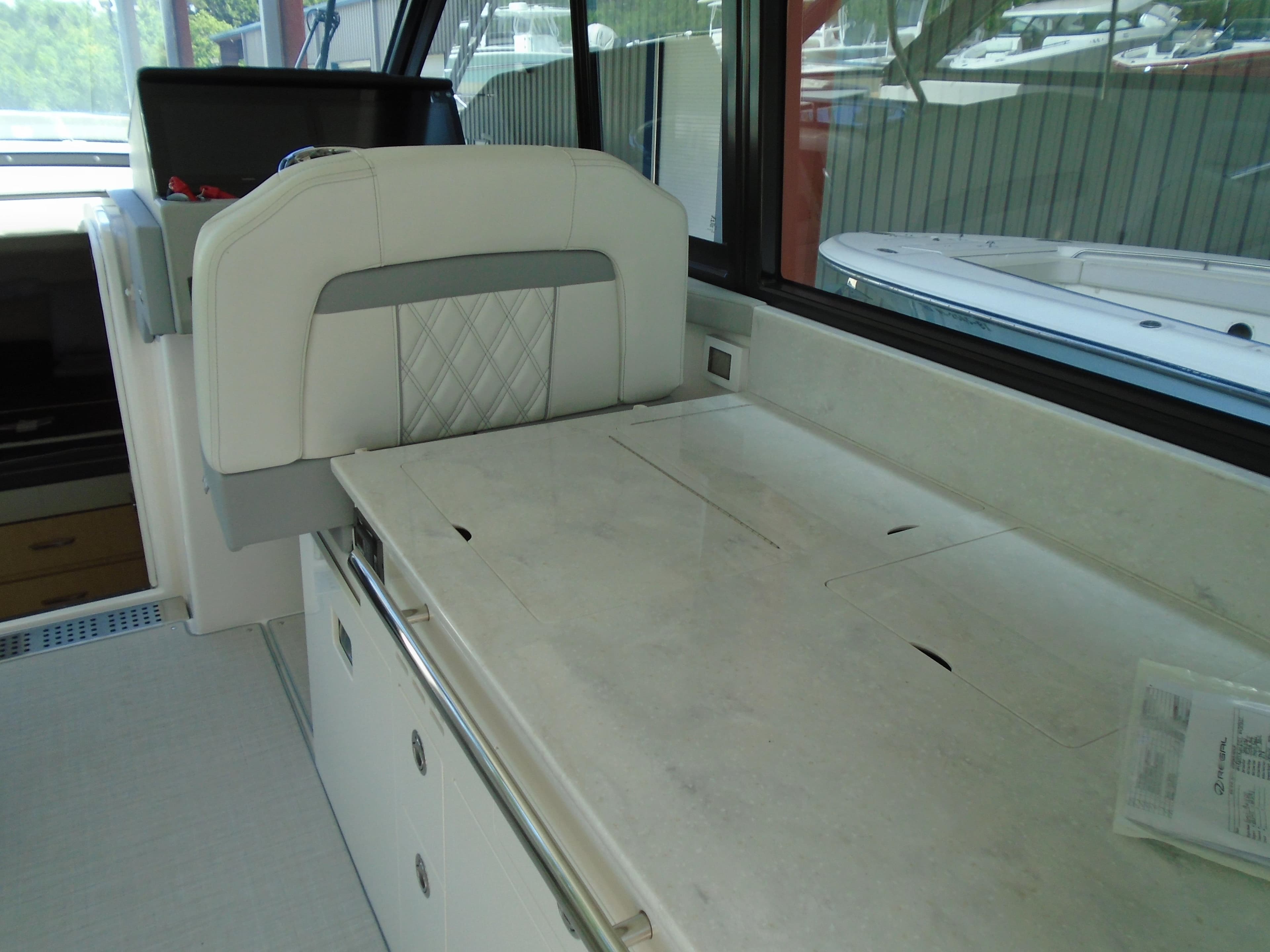 2024 Regal 36XO yacht interior with white seating and countertop.