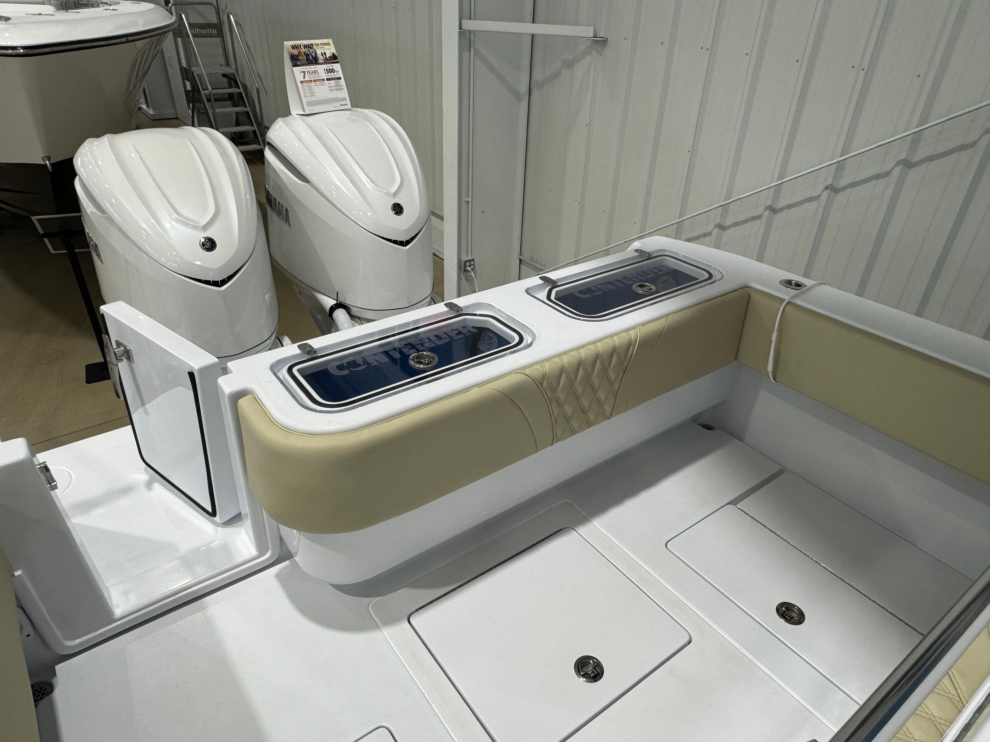 2025 Contender 32 ST boat interior with dual engines and seating area.