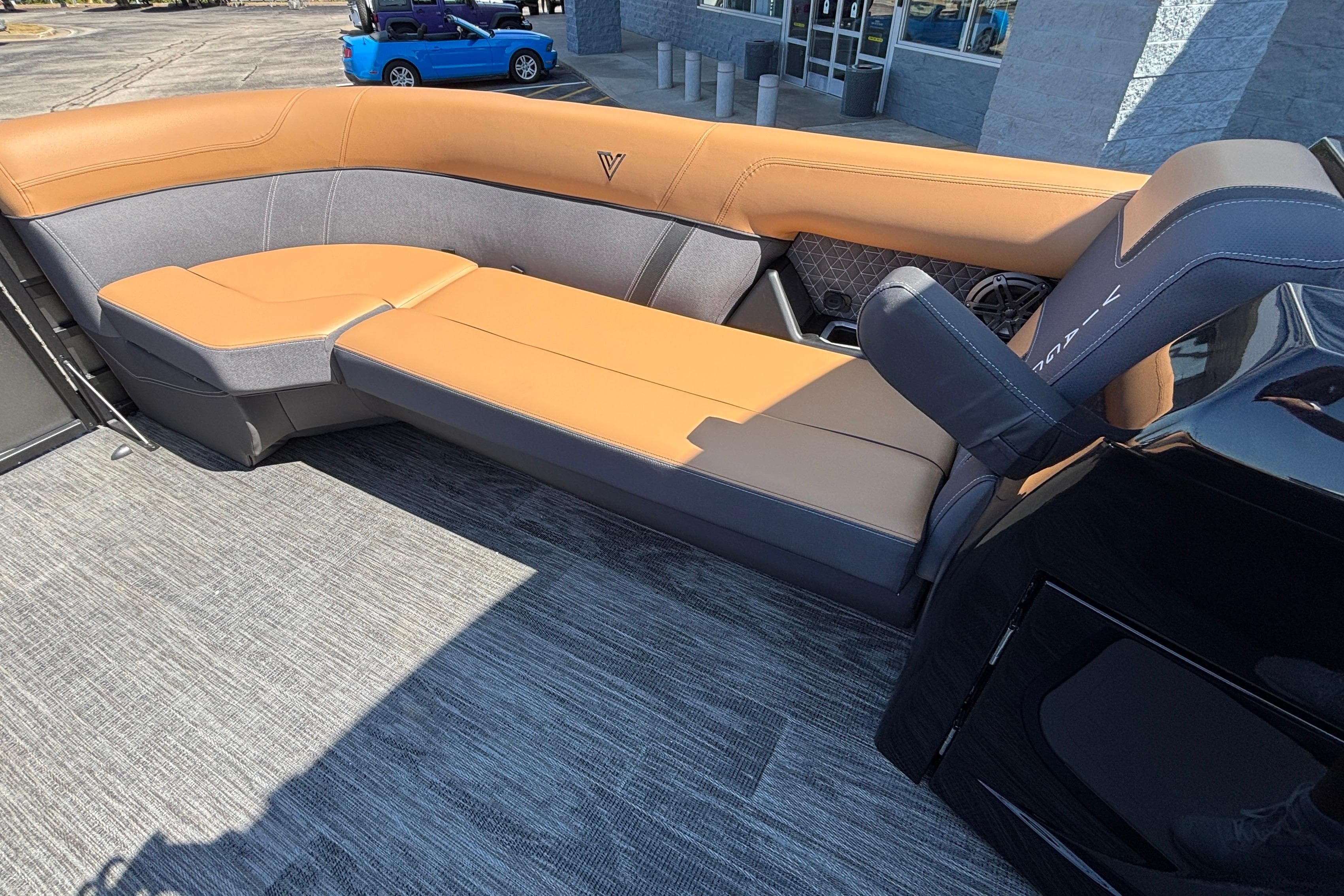 Luxurious seating on 2026 Viaggio Z24U boat, featuring tan and gray upholstery.