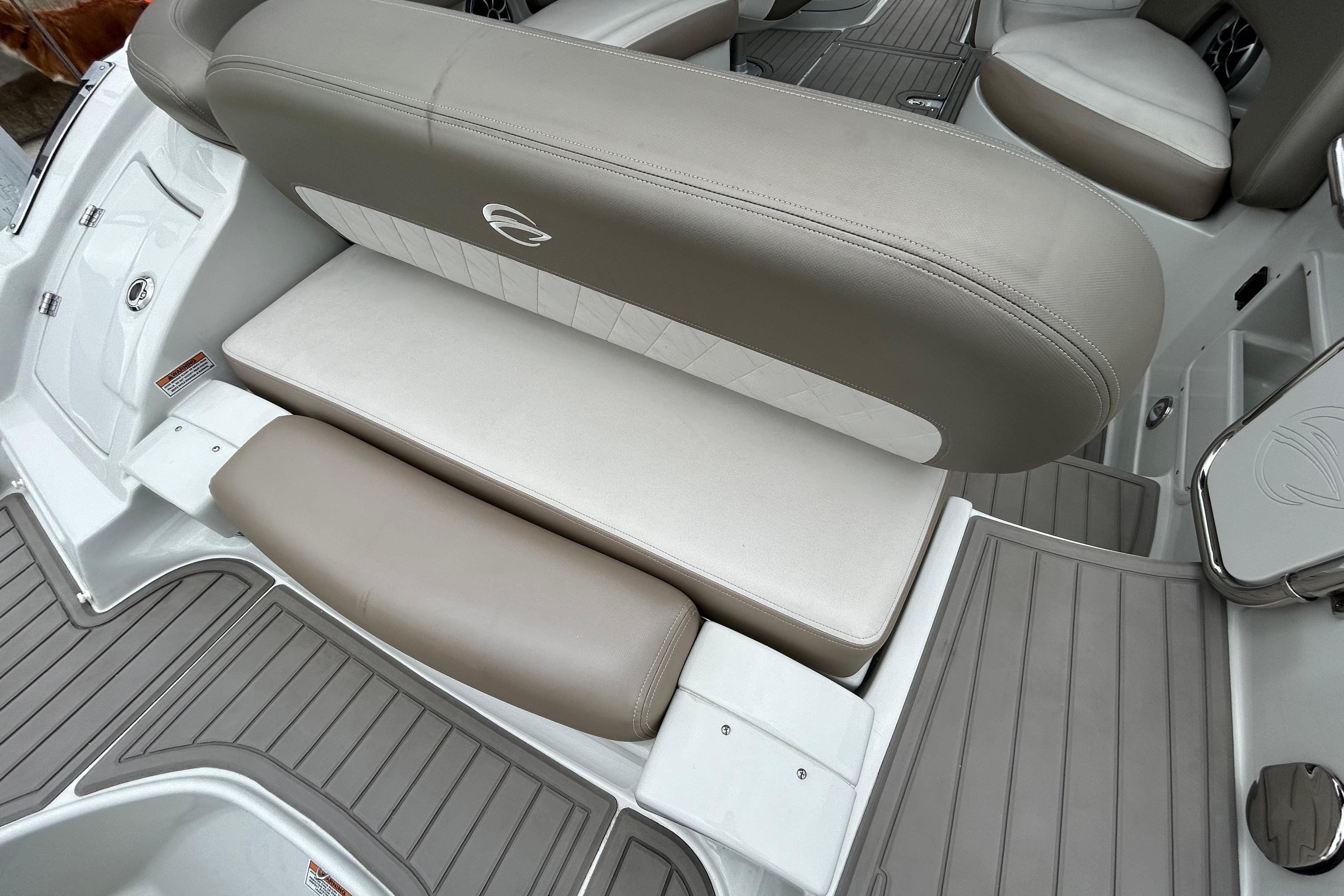 2022 Crownline 270 XSS boat interior with beige seating and sleek design.