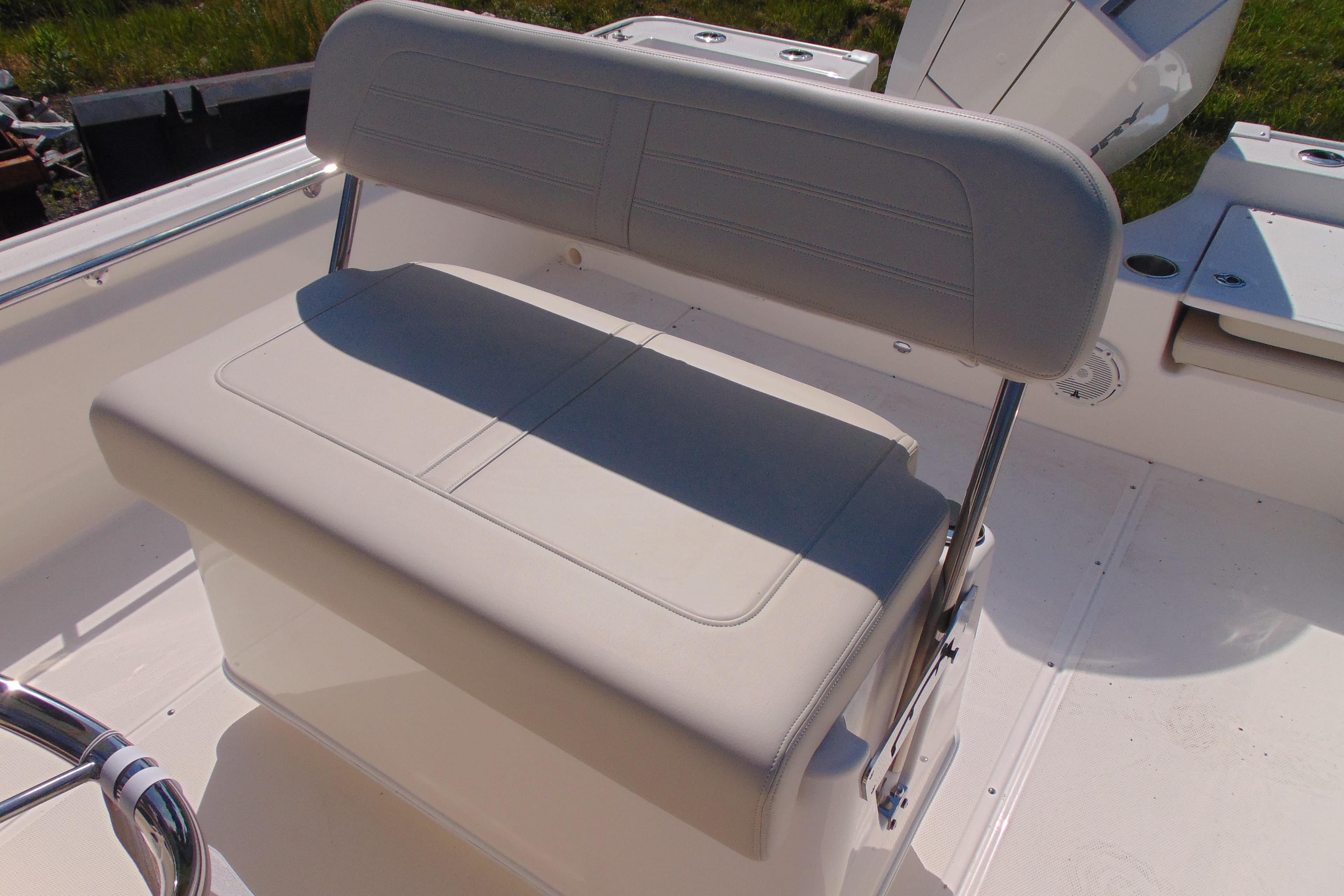 2026 Boston Whaler 210 Montauk boat seat, featuring sleek white upholstery.