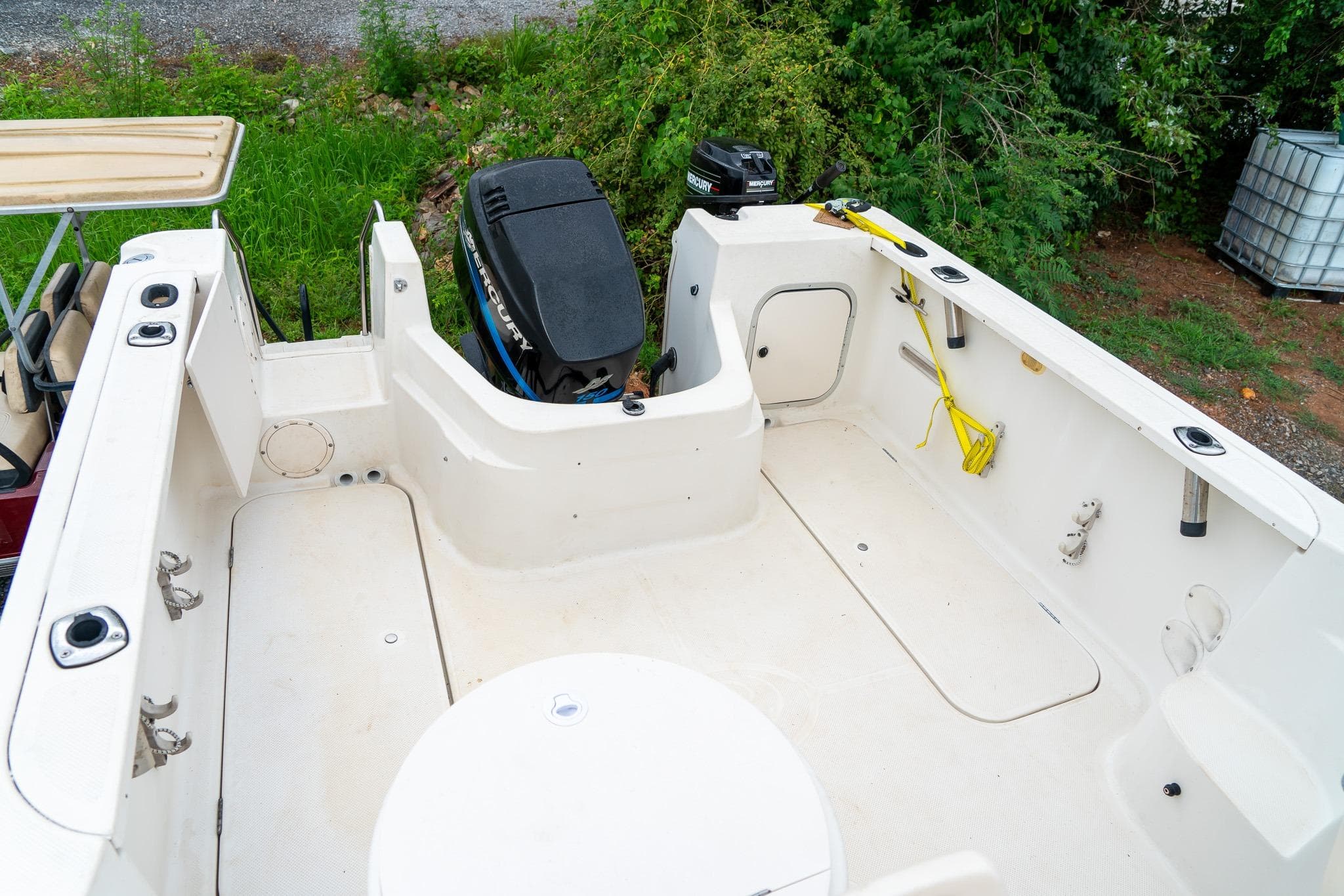 2002 Bayliner 2302 Trophy Walkaround boat interior with Mercury outboard motor.
