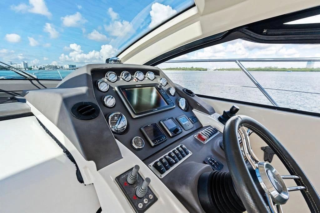 Cockpit of 2013 Azimut Atlantis 48 yacht overlooking the water.