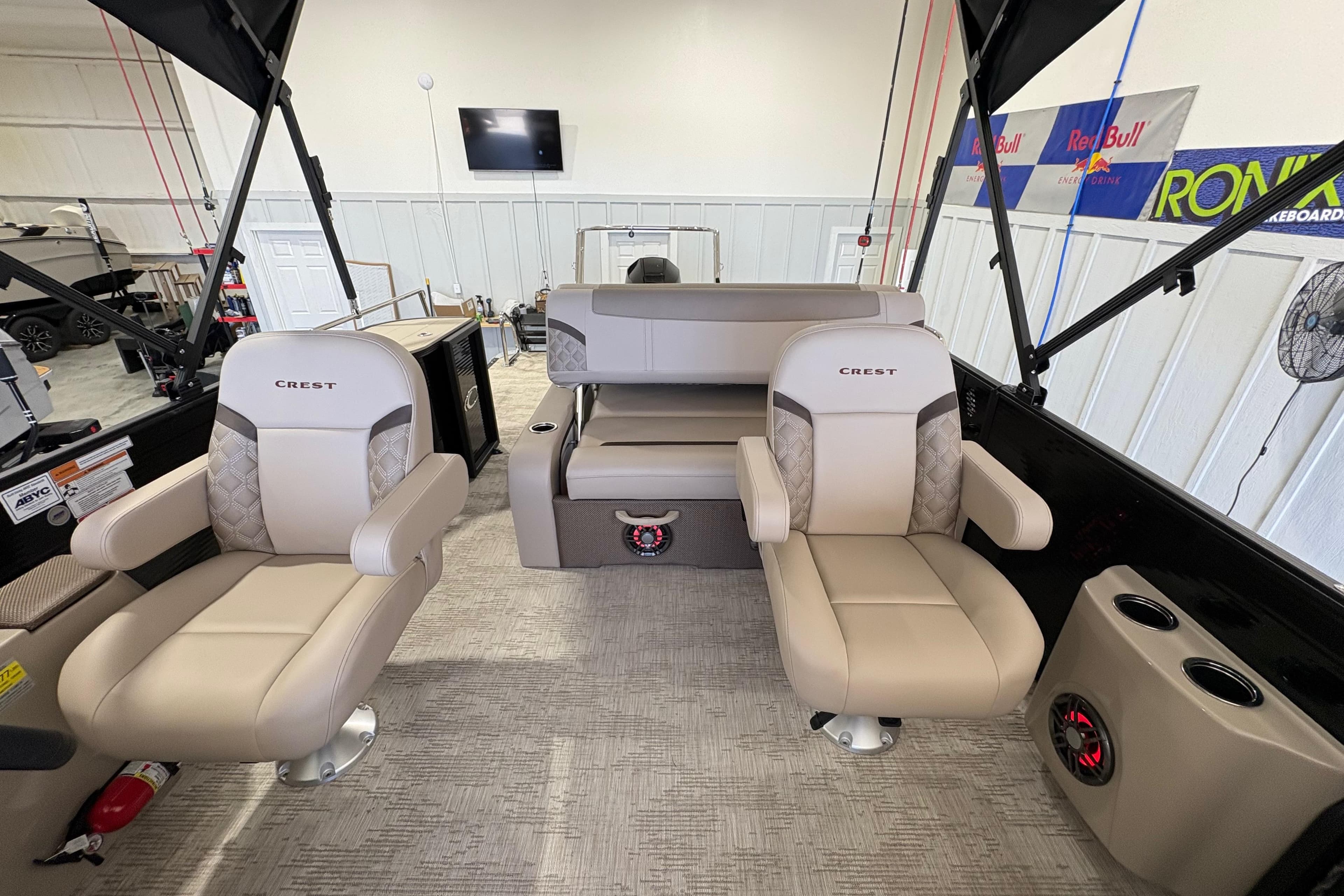 2025 Crest Classic 220 boat interior with beige seating and modern design.
