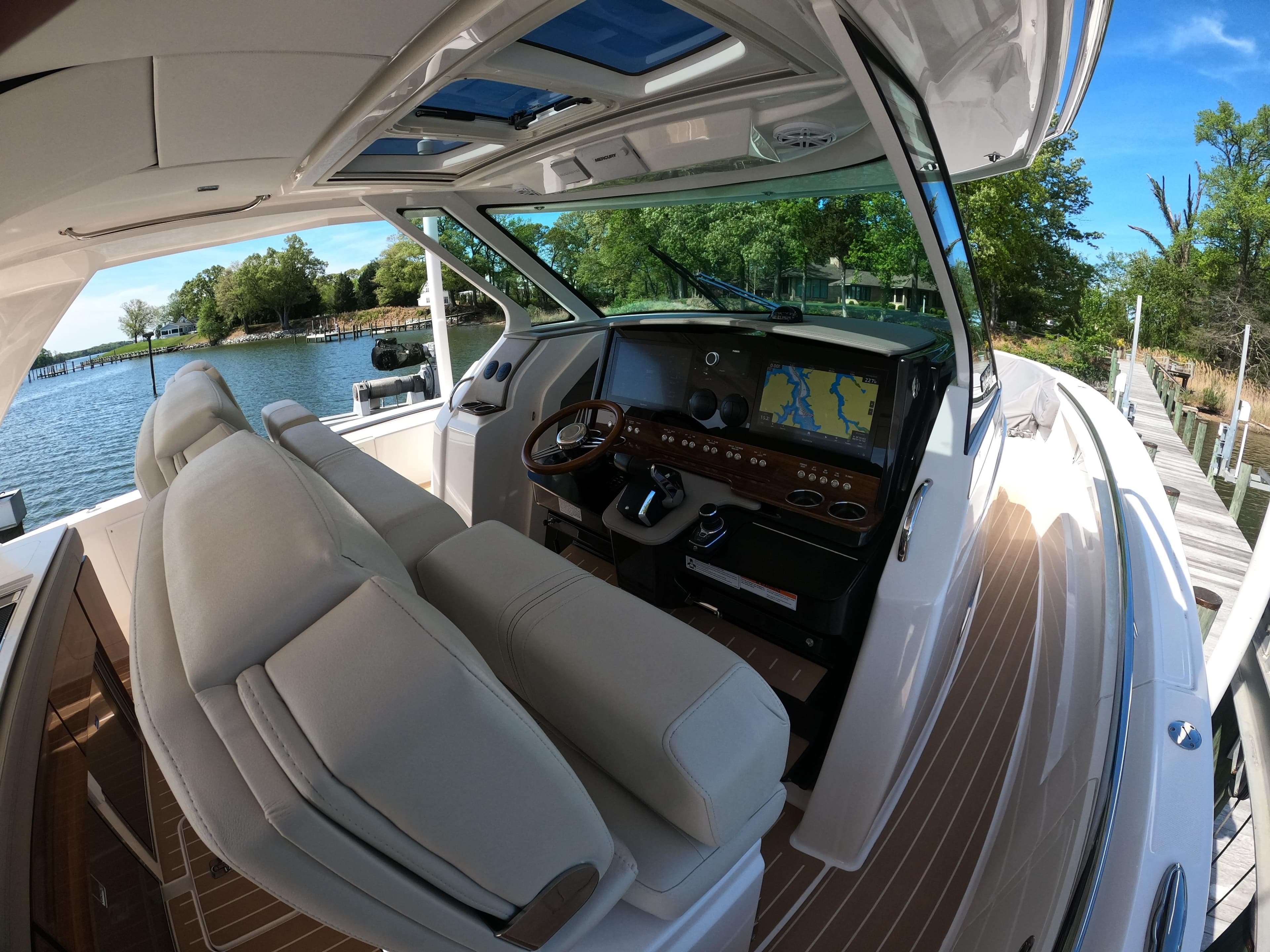 2024 Tiara Yachts 43 LS cockpit with luxurious seating and advanced navigation system.
