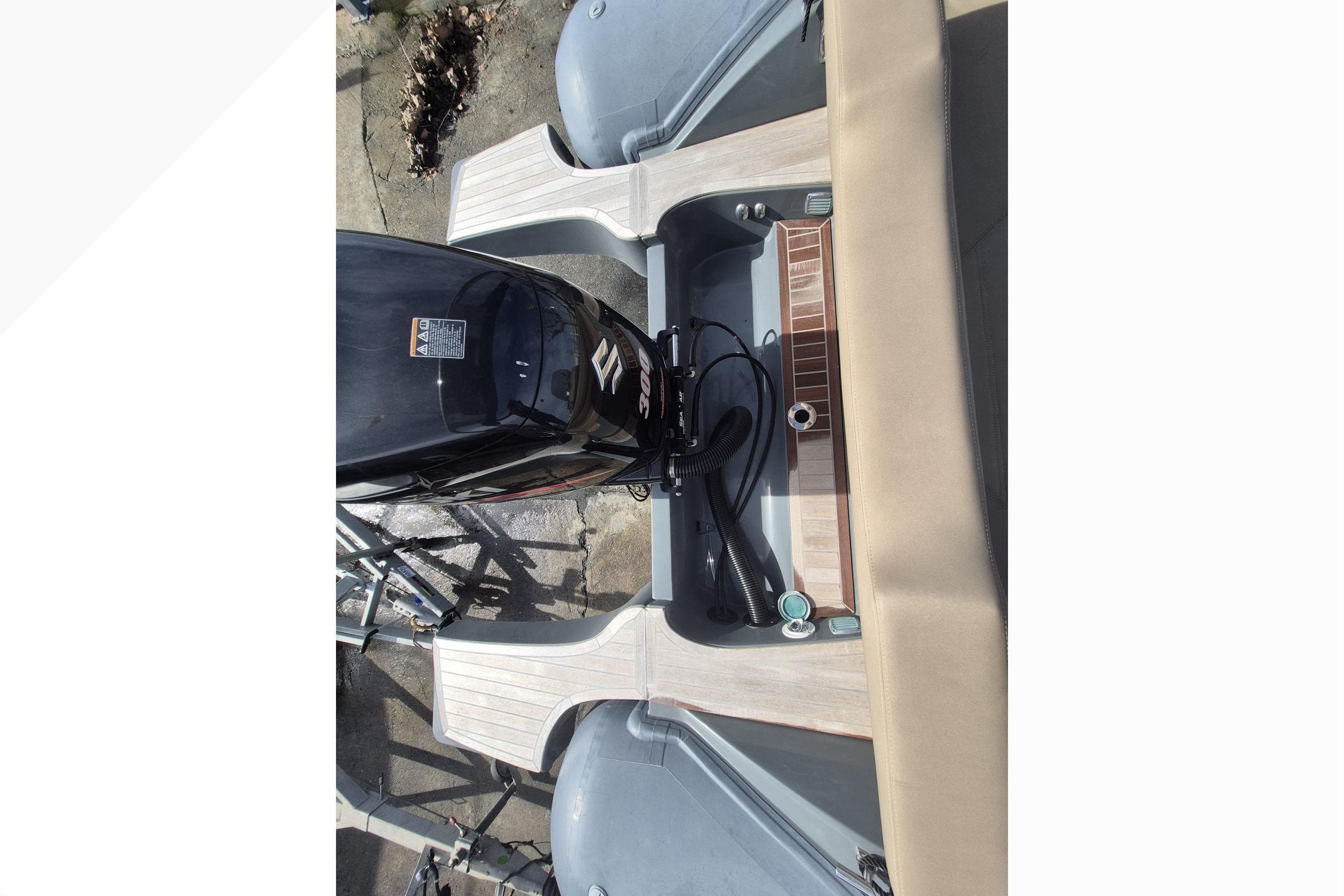 2020 SACS Strider 800 boat engine and deck view from above.