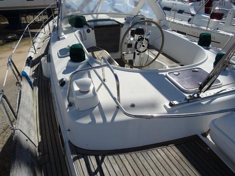 1995 Beneteau Oceanis 40 CC sailboat cockpit with steering wheel and deck details.