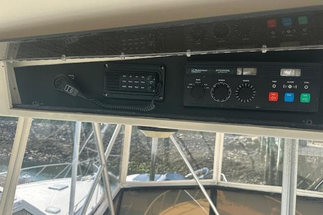 Control panel of a 1988 Viking 45 Convertible boat with communication equipment.