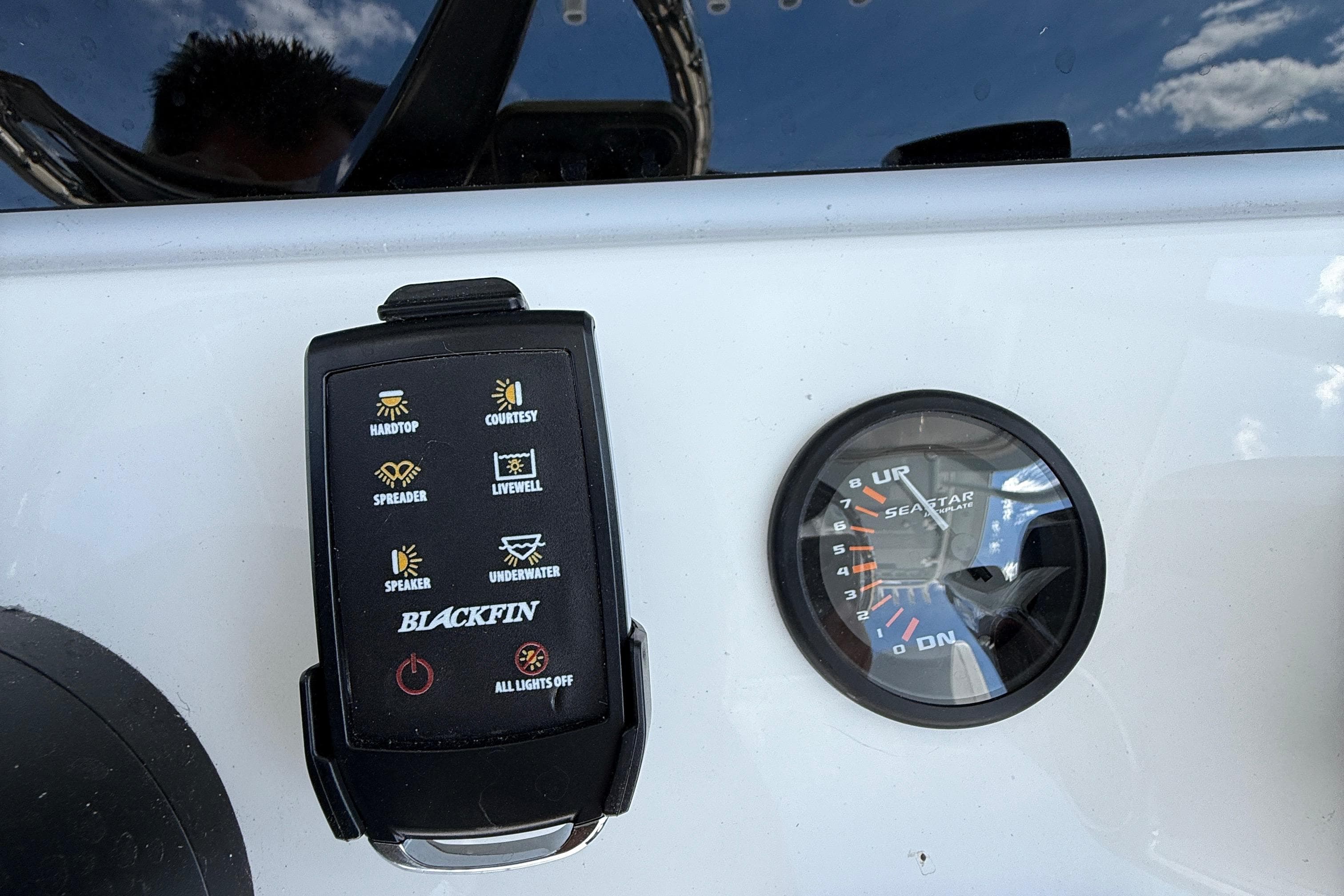 Control panel and gauge on a 2026 Blackfin 242 HB boat dashboard.