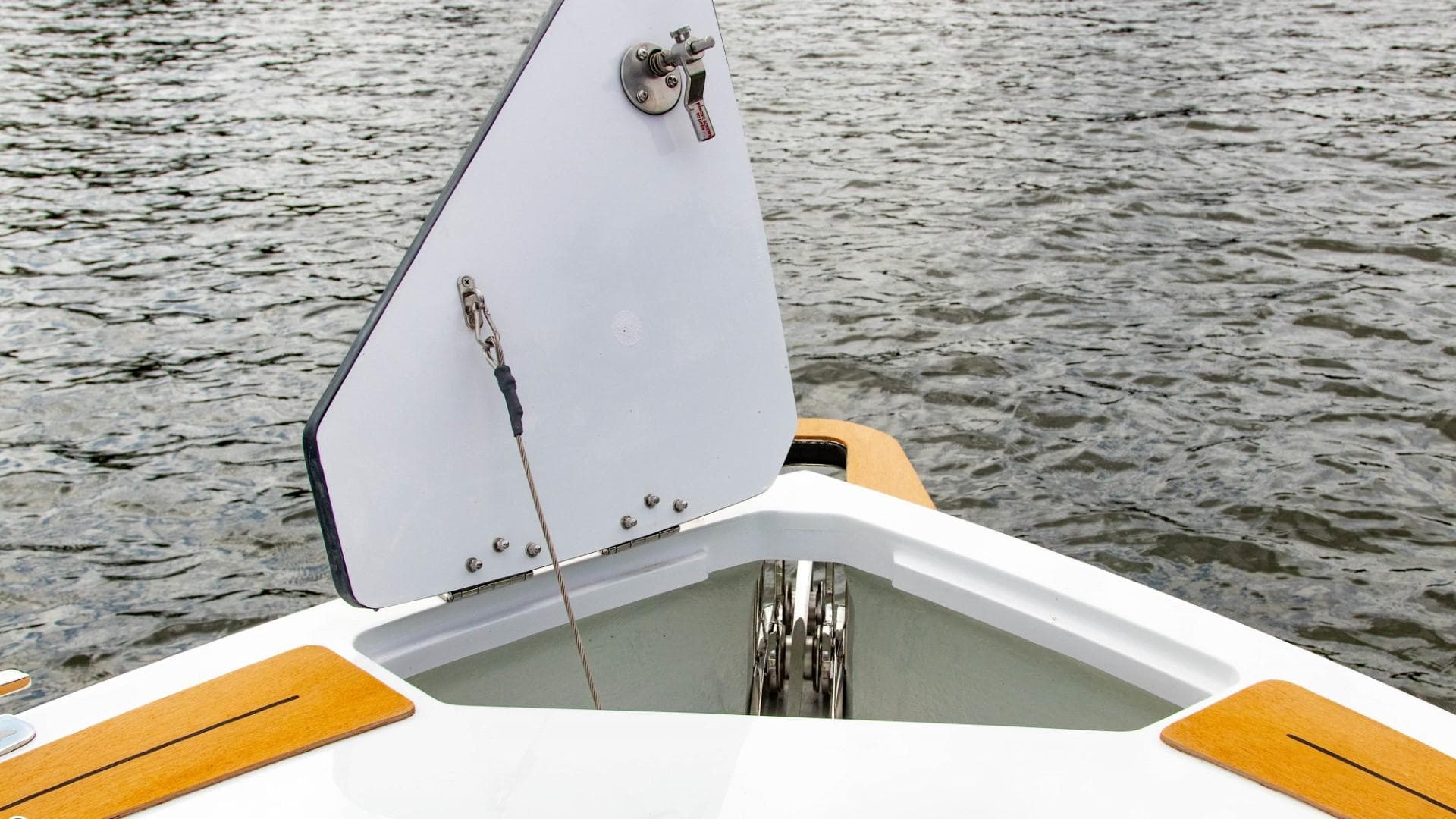 2023 Alfastreet 21 Open boat anchor compartment with open hatch on water.