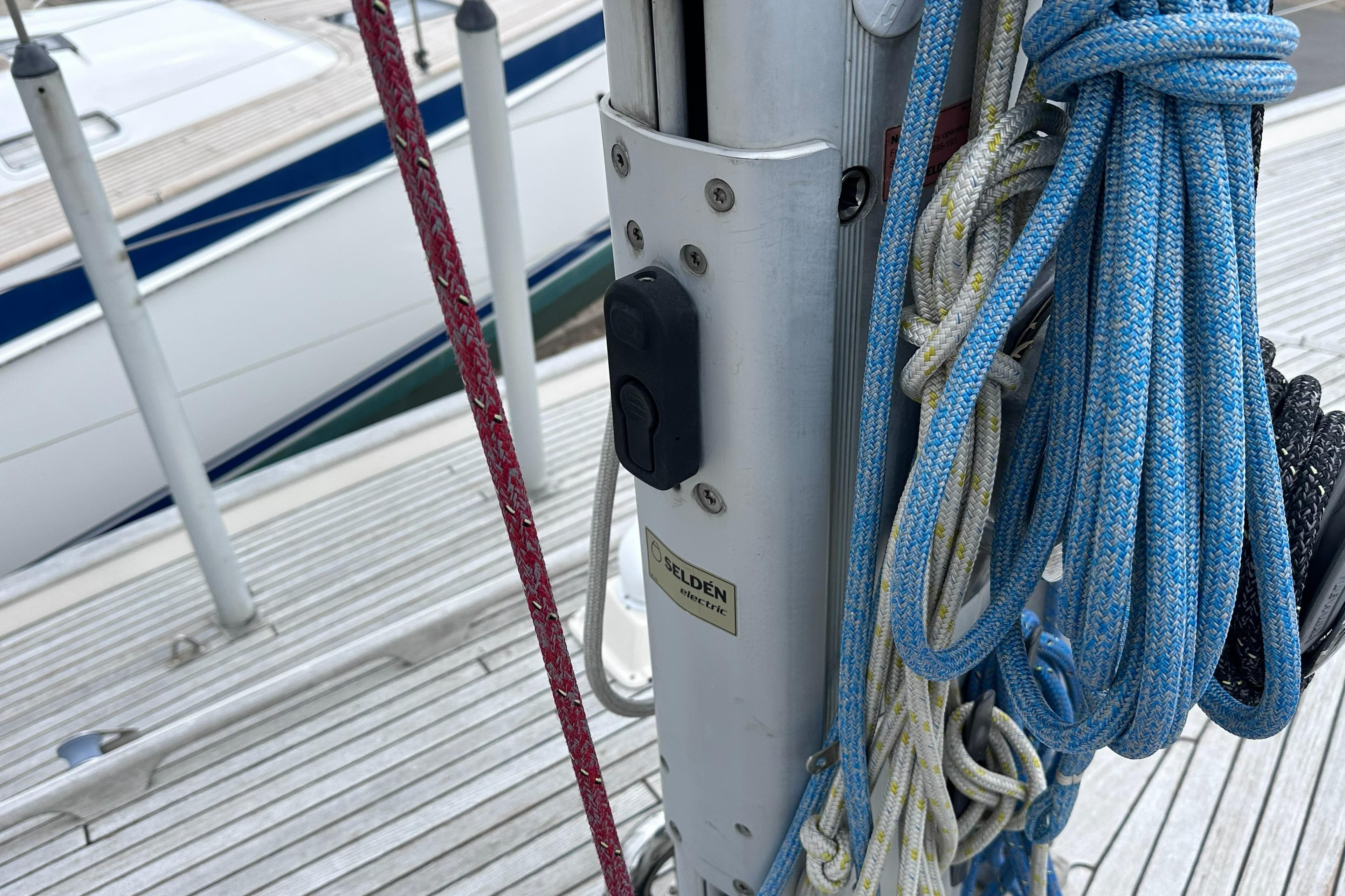 Close-up of Hallberg-Rassy 46 sailboat rigging and ropes, showcasing deck details, 2000 model.