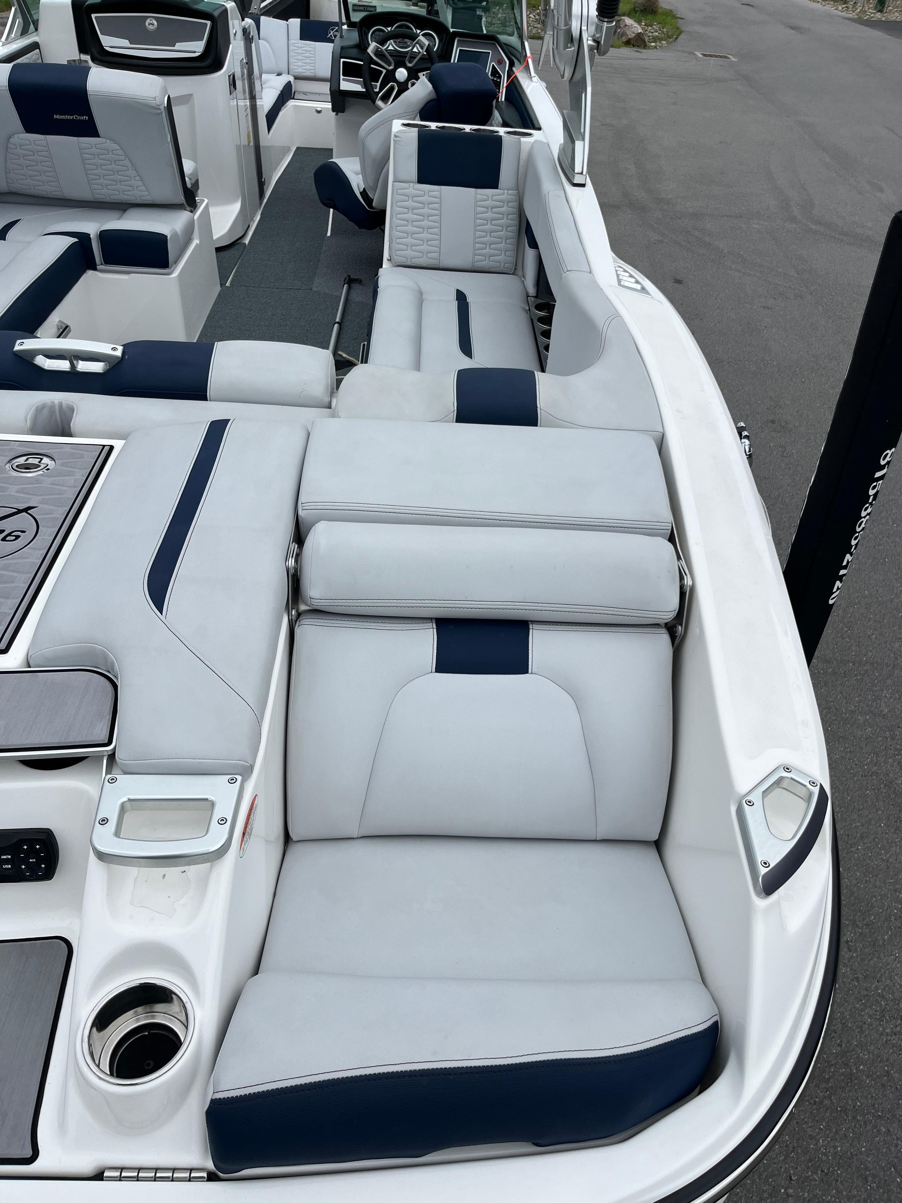 2019 MasterCraft X26 boat interior with white and navy seating.