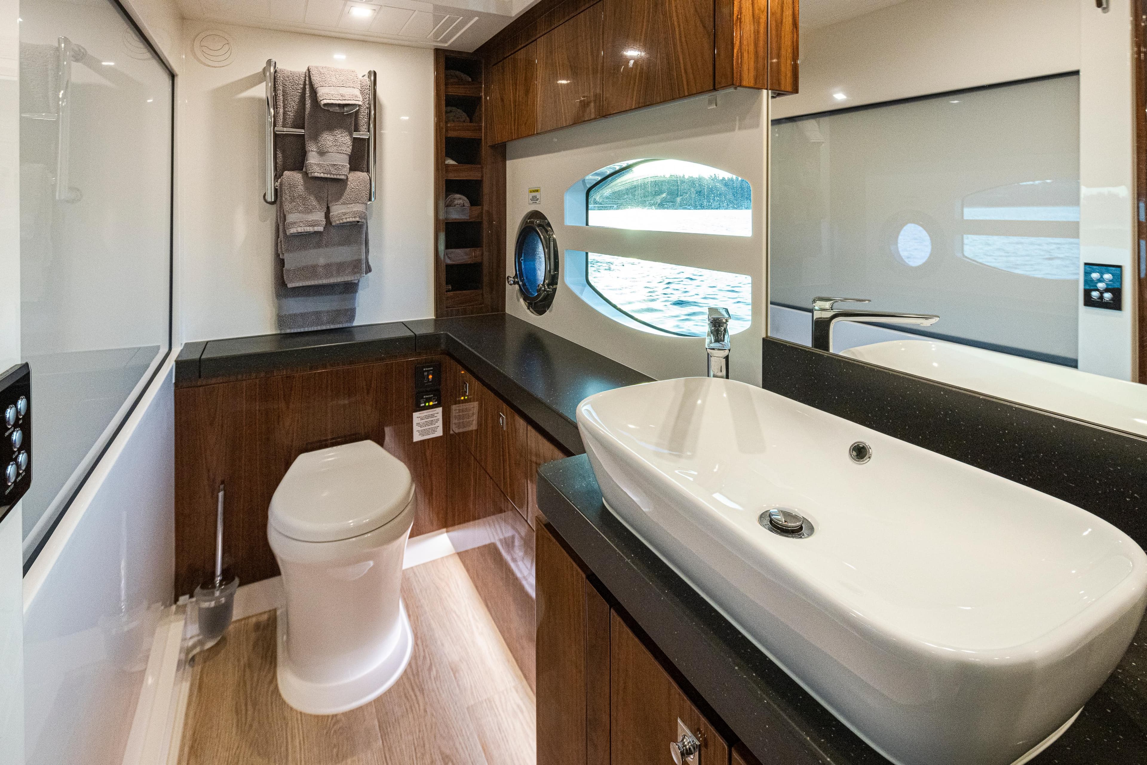 Luxurious bathroom interior of 2017 Riviera Sport Cruiser yacht with modern fixtures.