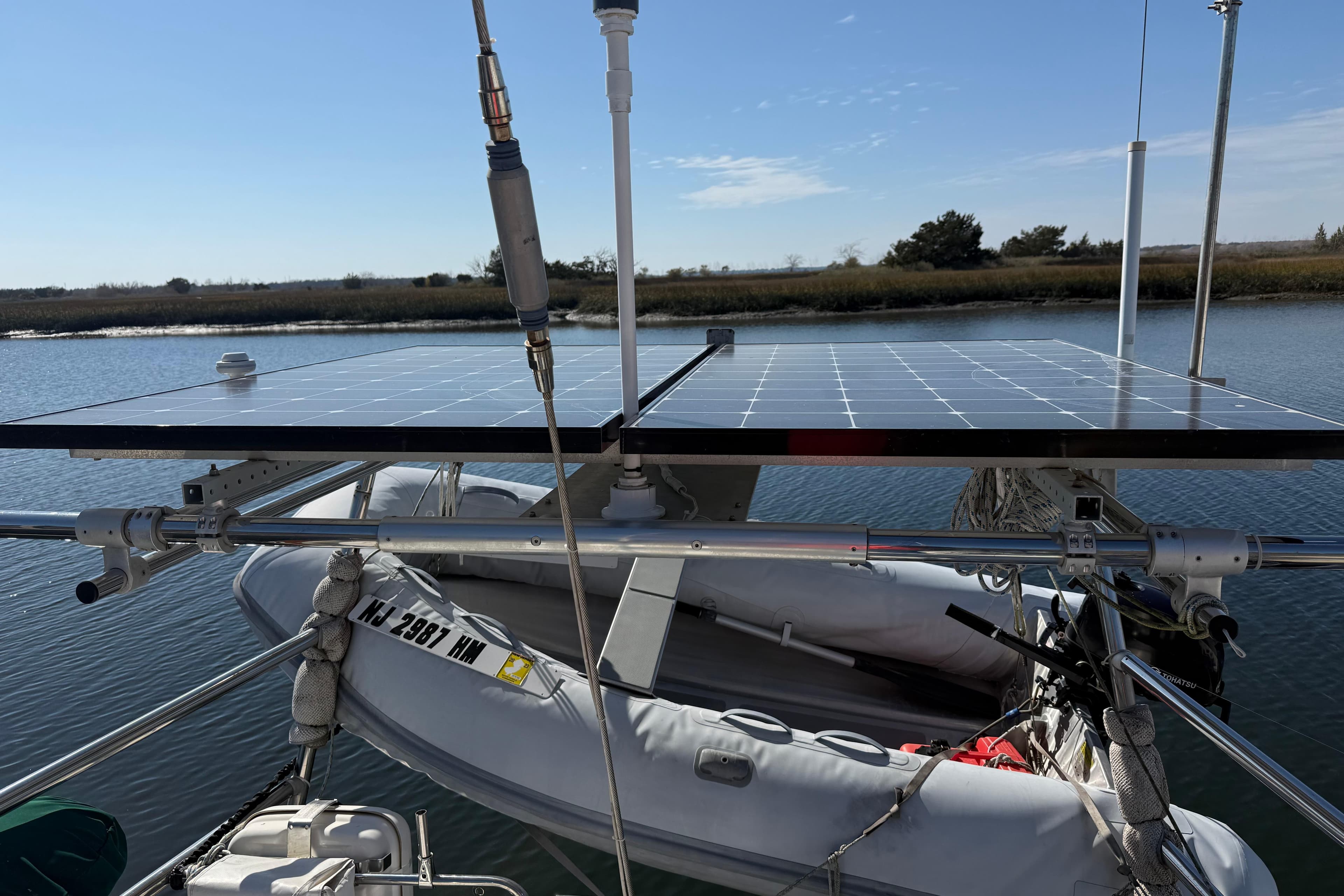 Solar panels on a boat with inflatable dinghy, Passport 456, 1999 model.