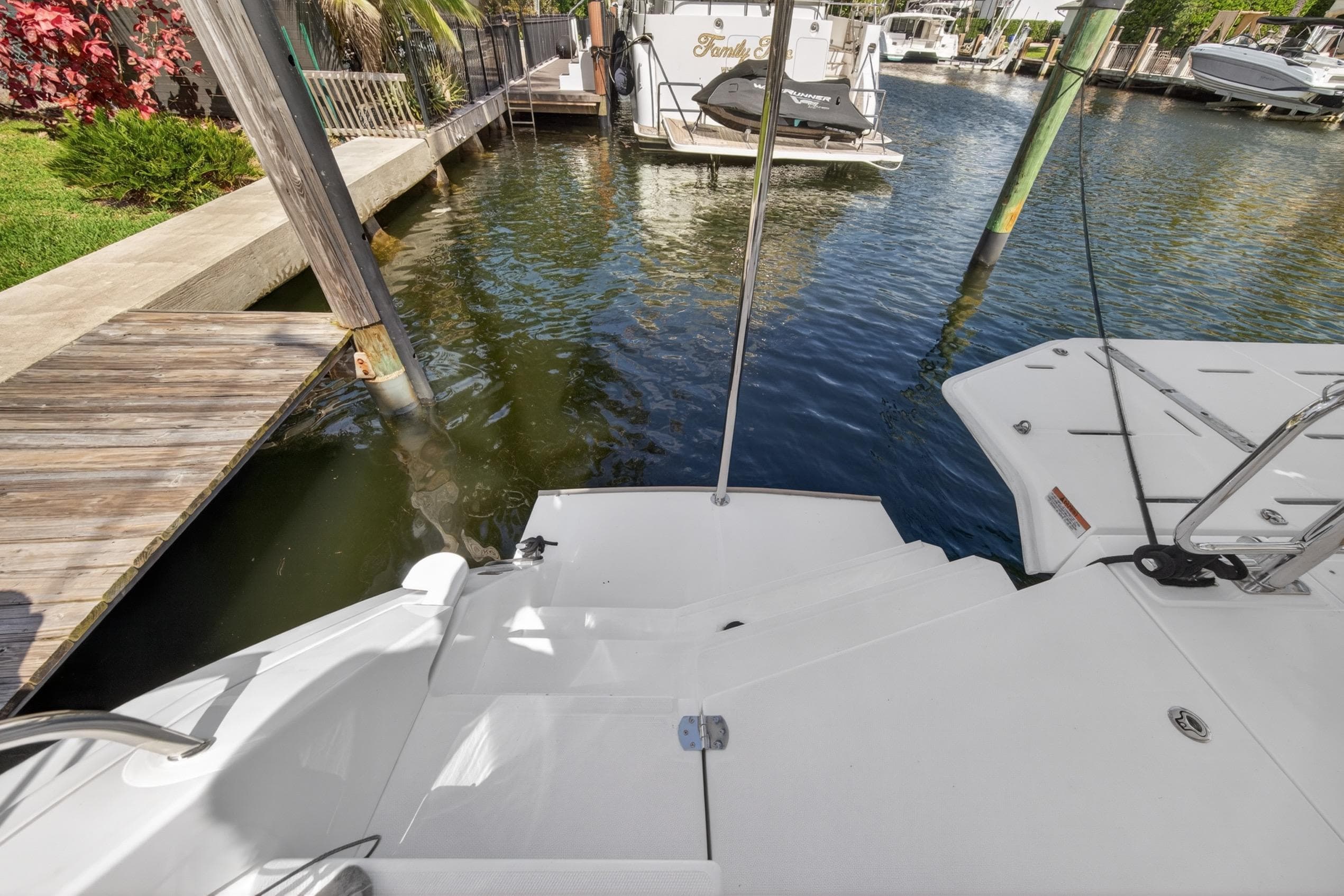 Stern view of 2022 Leopard 50 yacht docked at marina.