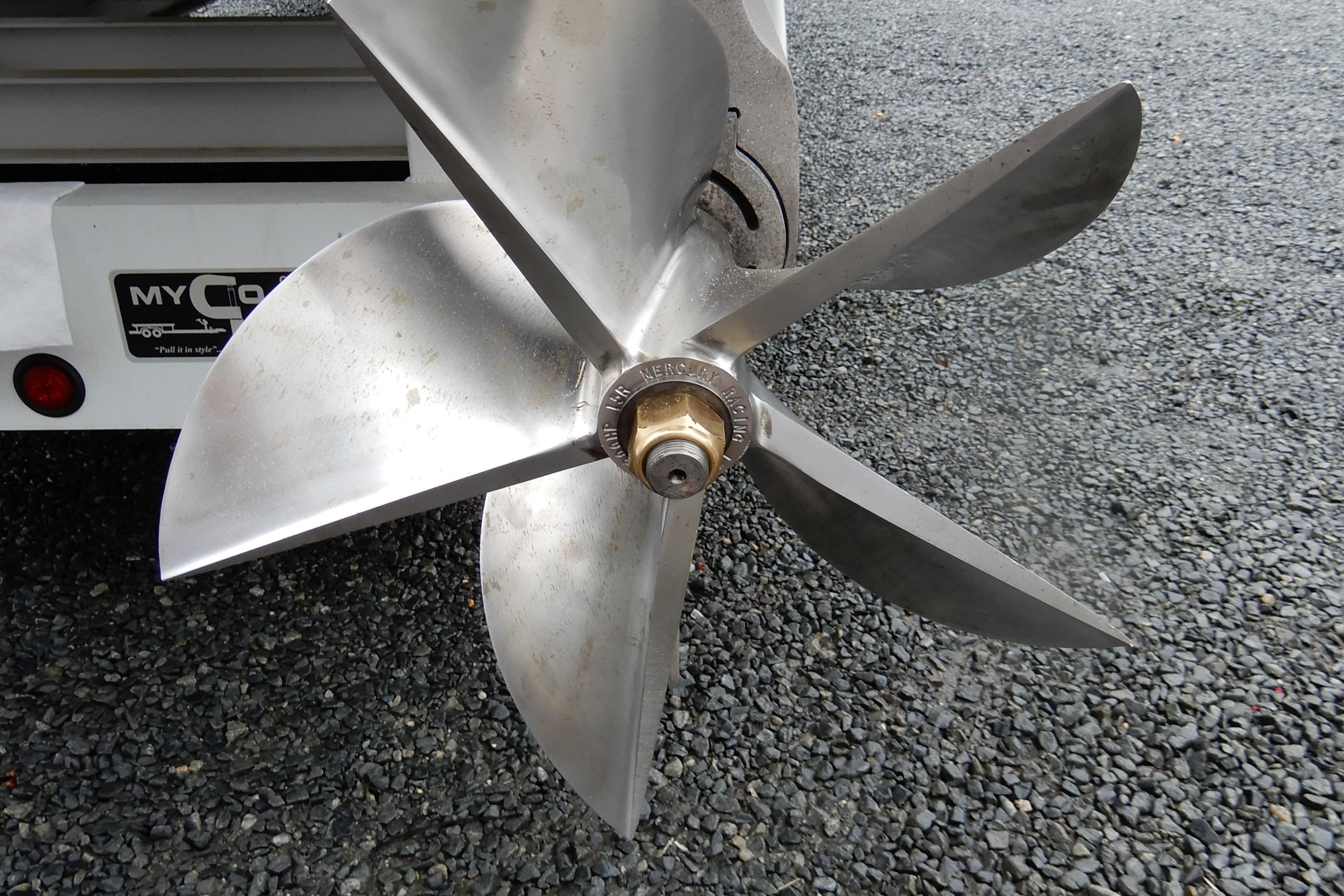 Propeller of 2008 Nor-Tech 3600 Supercat on gravel surface.