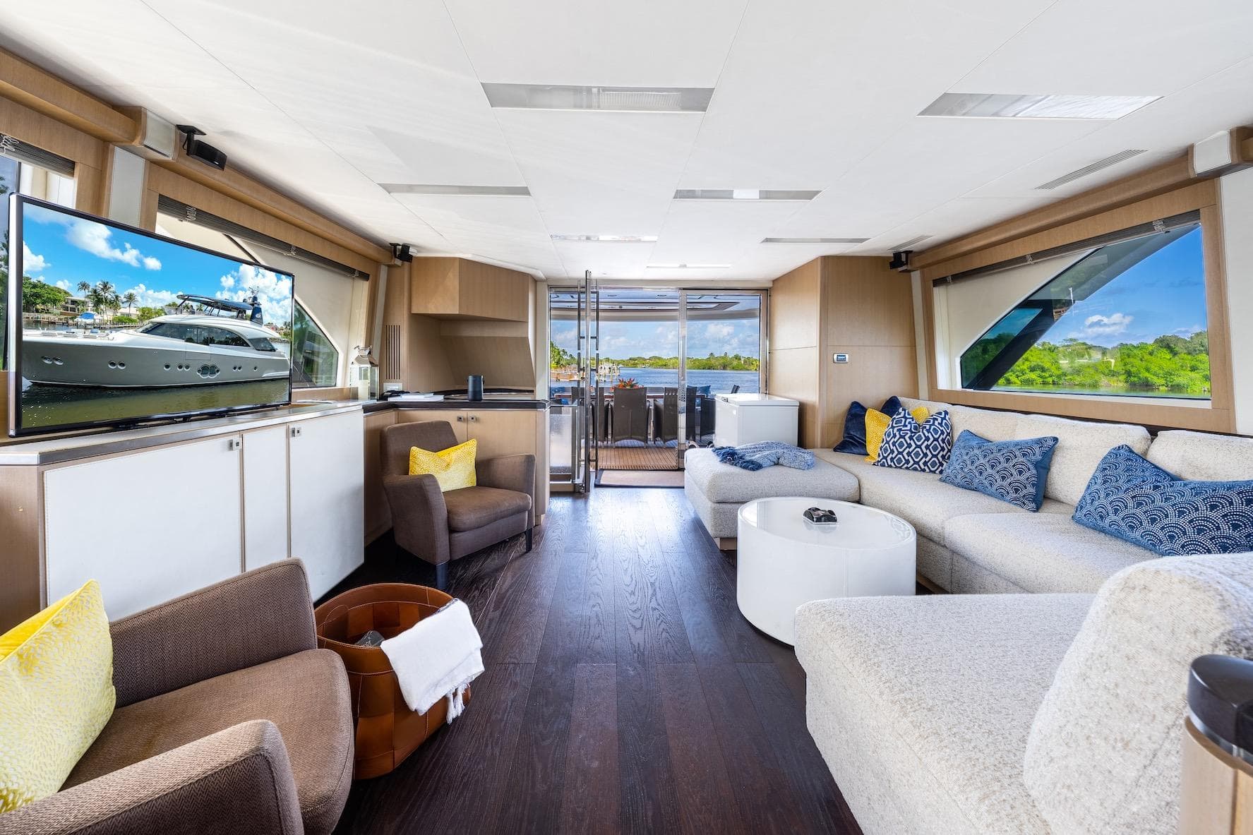 Luxurious interior of 2015 Monte Carlo Yachts MCY 86 with elegant seating and large windows.