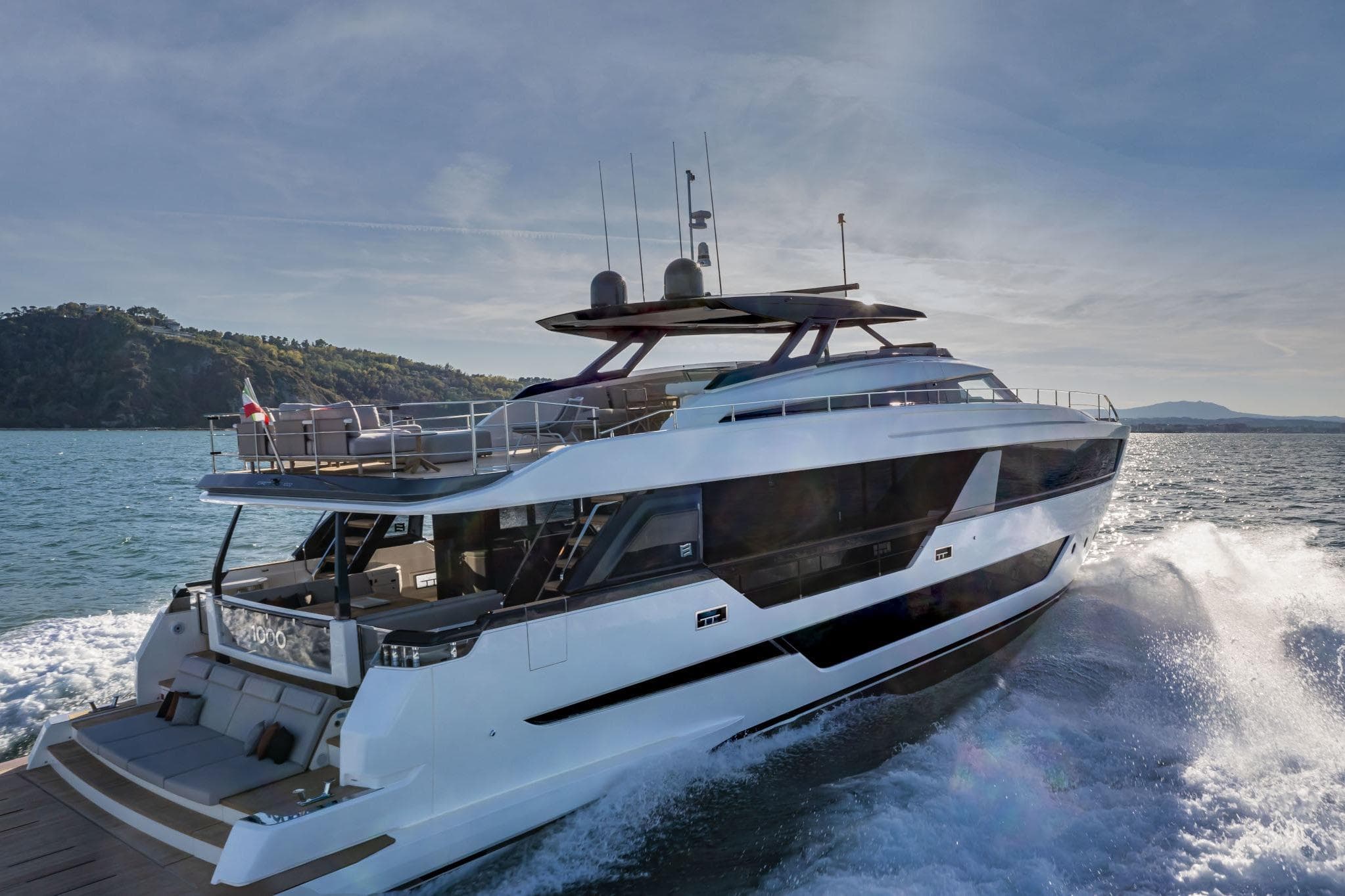 2023 Ferretti Yachts 1000 cruising on open water, showcasing sleek design and luxury features.