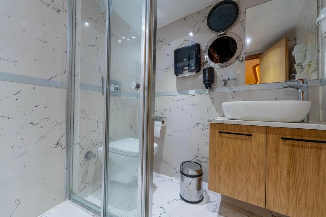 Luxurious bathroom on 2022 Gulet 24m yacht with modern fixtures and marble design.