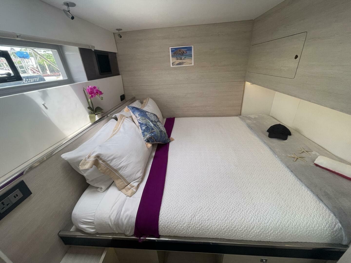 Luxurious bedroom interior on 2019 Leopard 50 yacht with elegant bedding and decor.