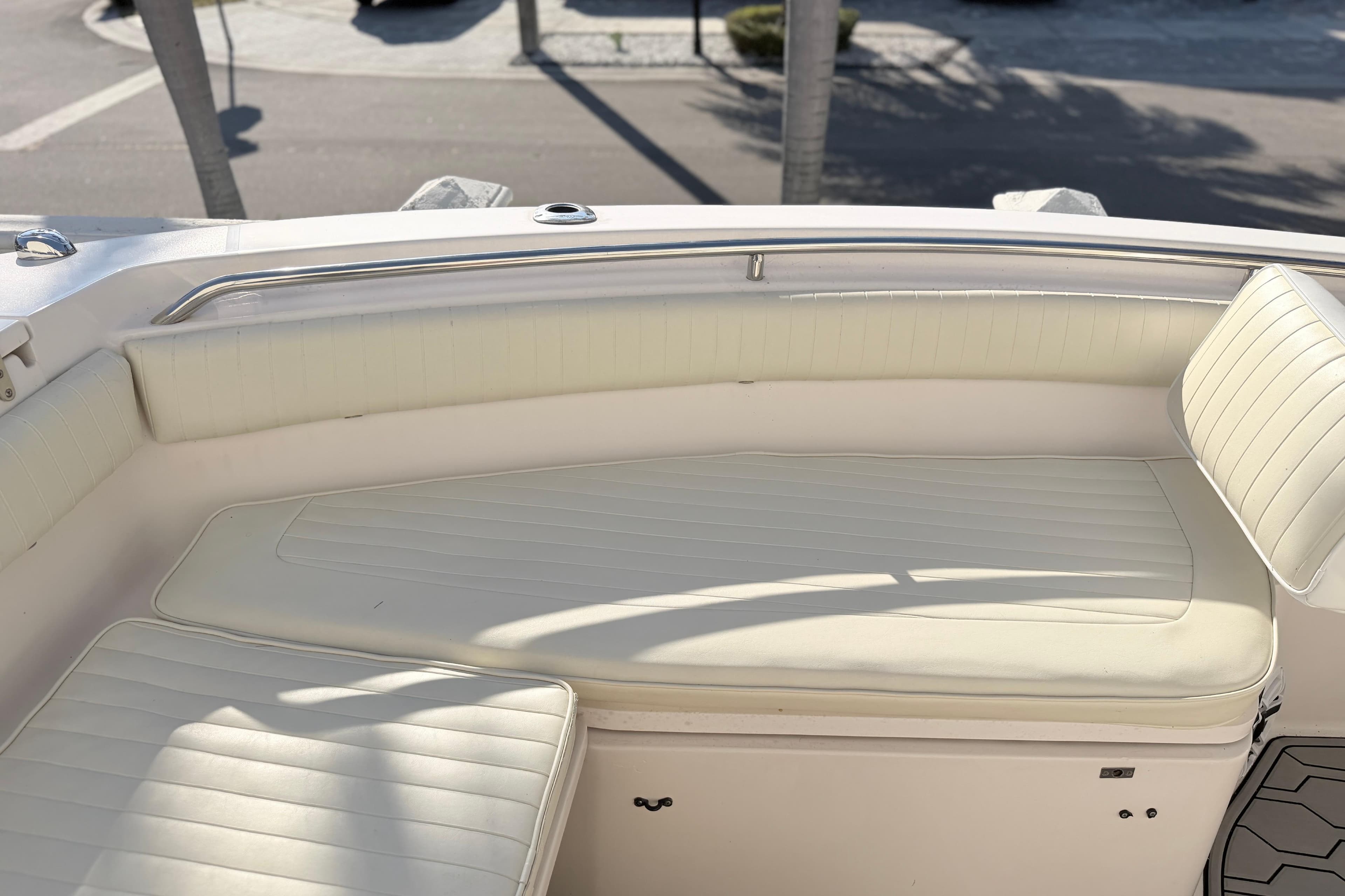 2004 Grady White 273 boat interior with white cushioned seating.