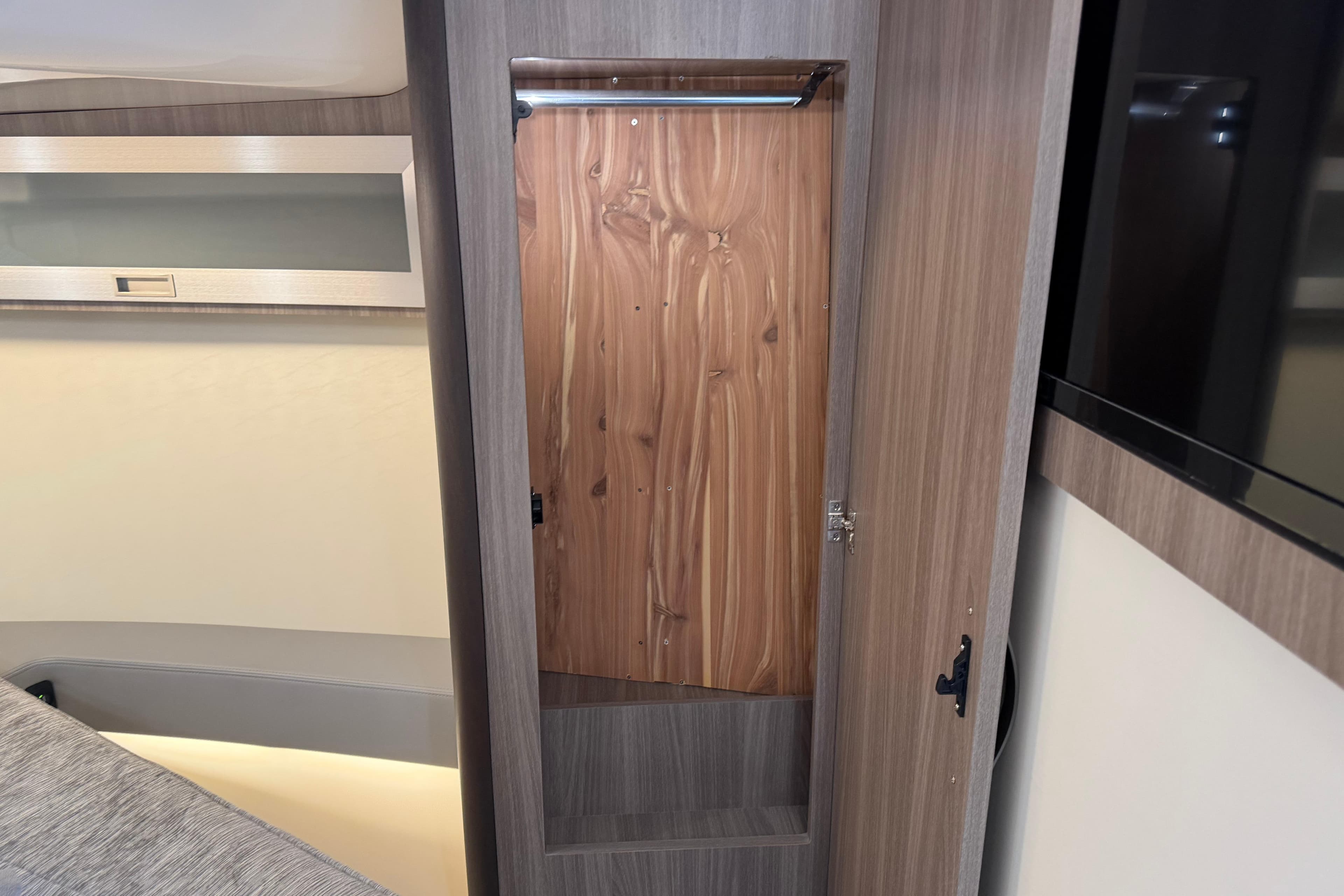 2021 Regal 36 XO interior closet with wooden finish and modern design.