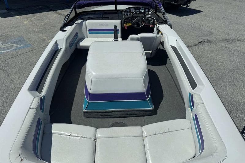 1995 Correct Craft Ski Nautique boat interior with white seating and dashboard.