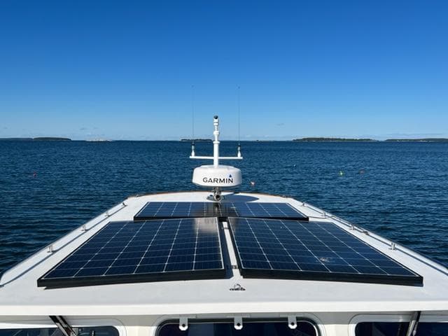 Duffy 35 Hardtop Cruiser with solar panels on the sea, year 2000.
