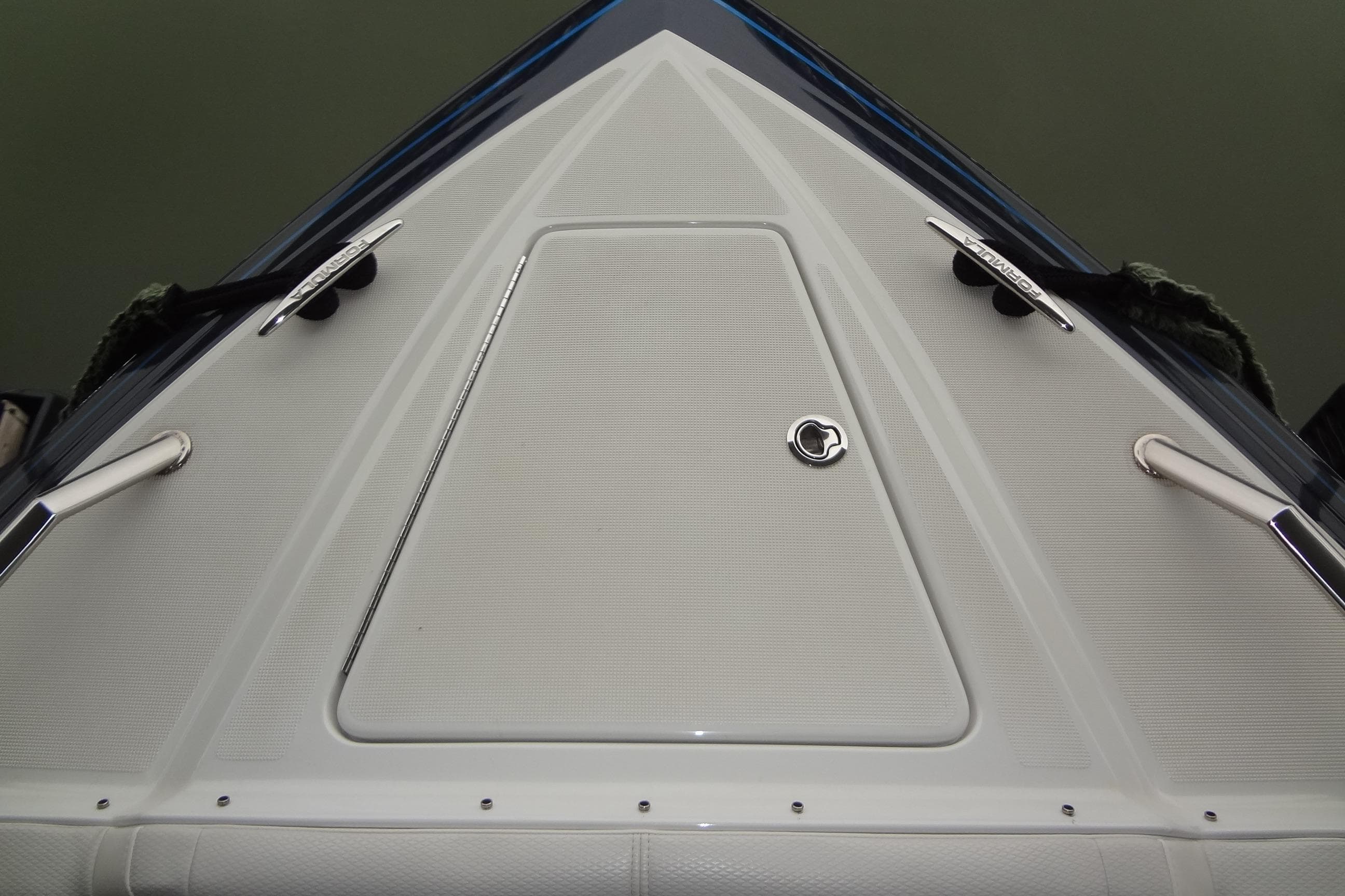 2023 Formula 380 Super Sport Crossover I/O boat deck, featuring sleek design and stainless steel fittings.