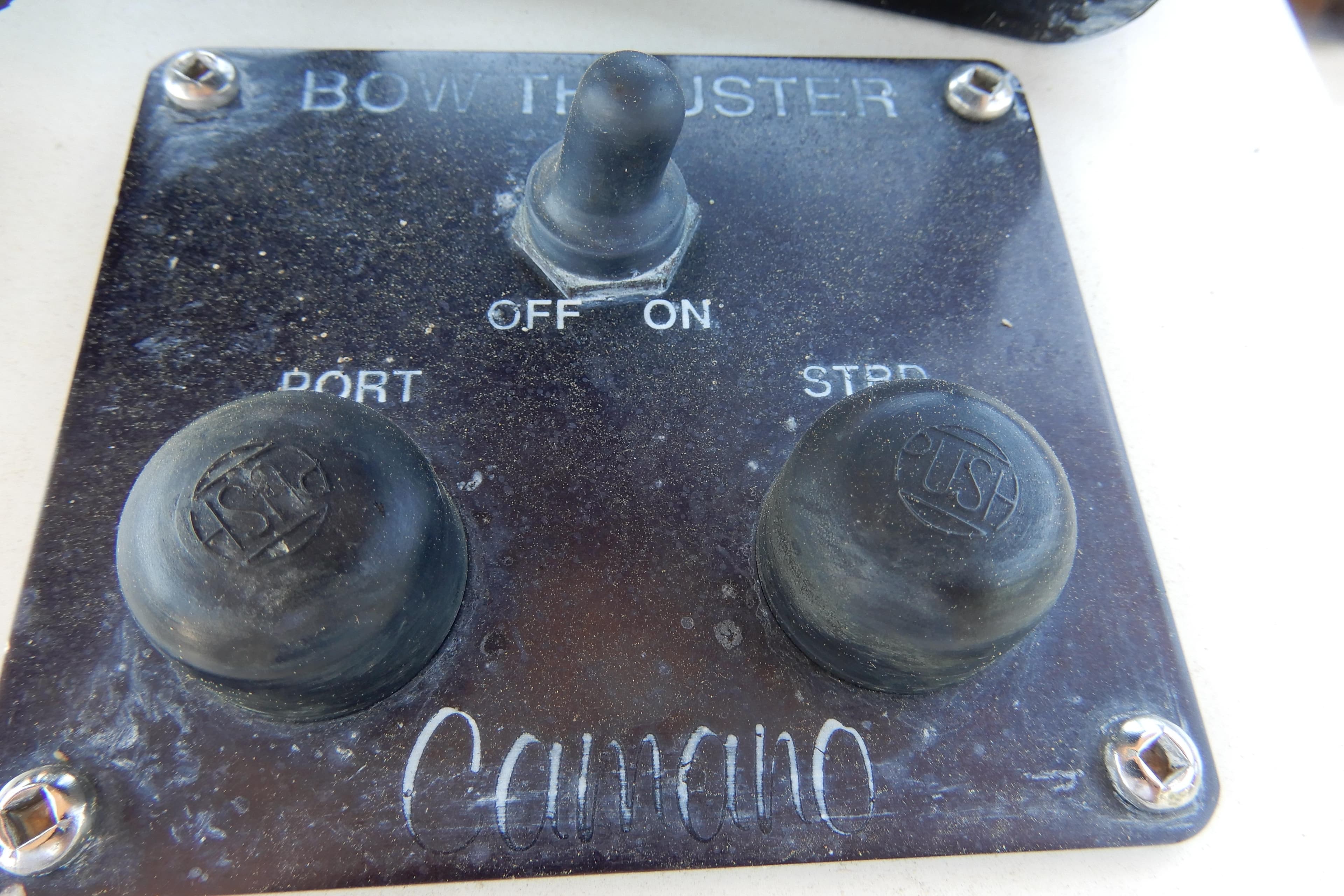 Control panel of a 1996 Camano 31 Troll boat with bow thruster switches.