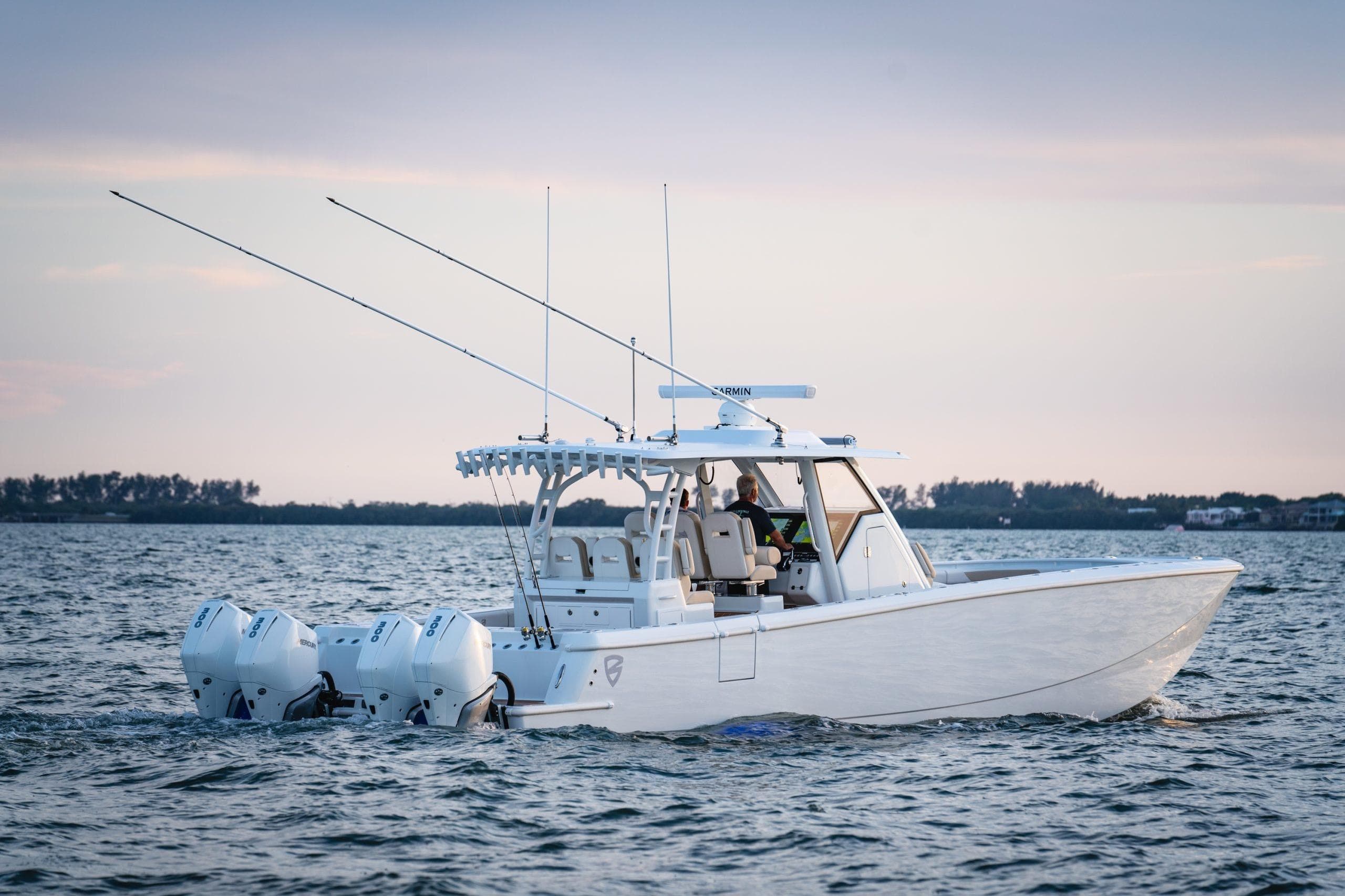 2026 Barker Boatworks 40HPC cruising on open water at sunset.