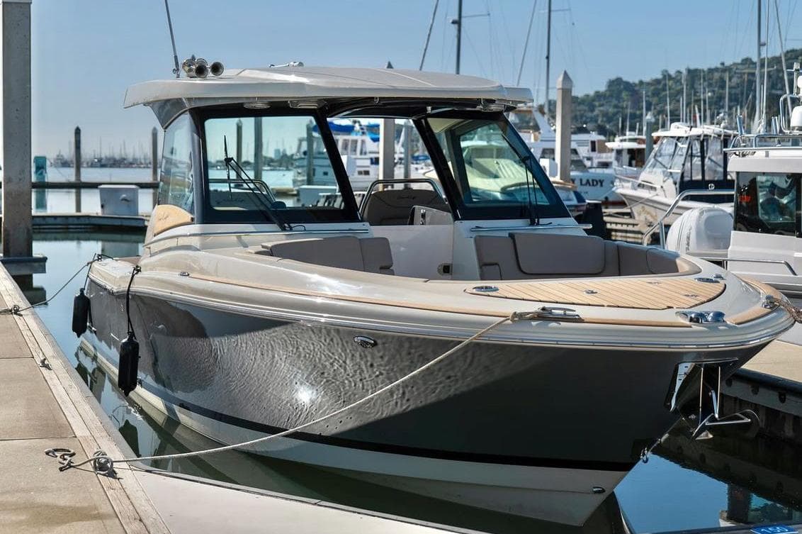 2024 Chris-Craft Calypso 32 luxury boat docked at marina.