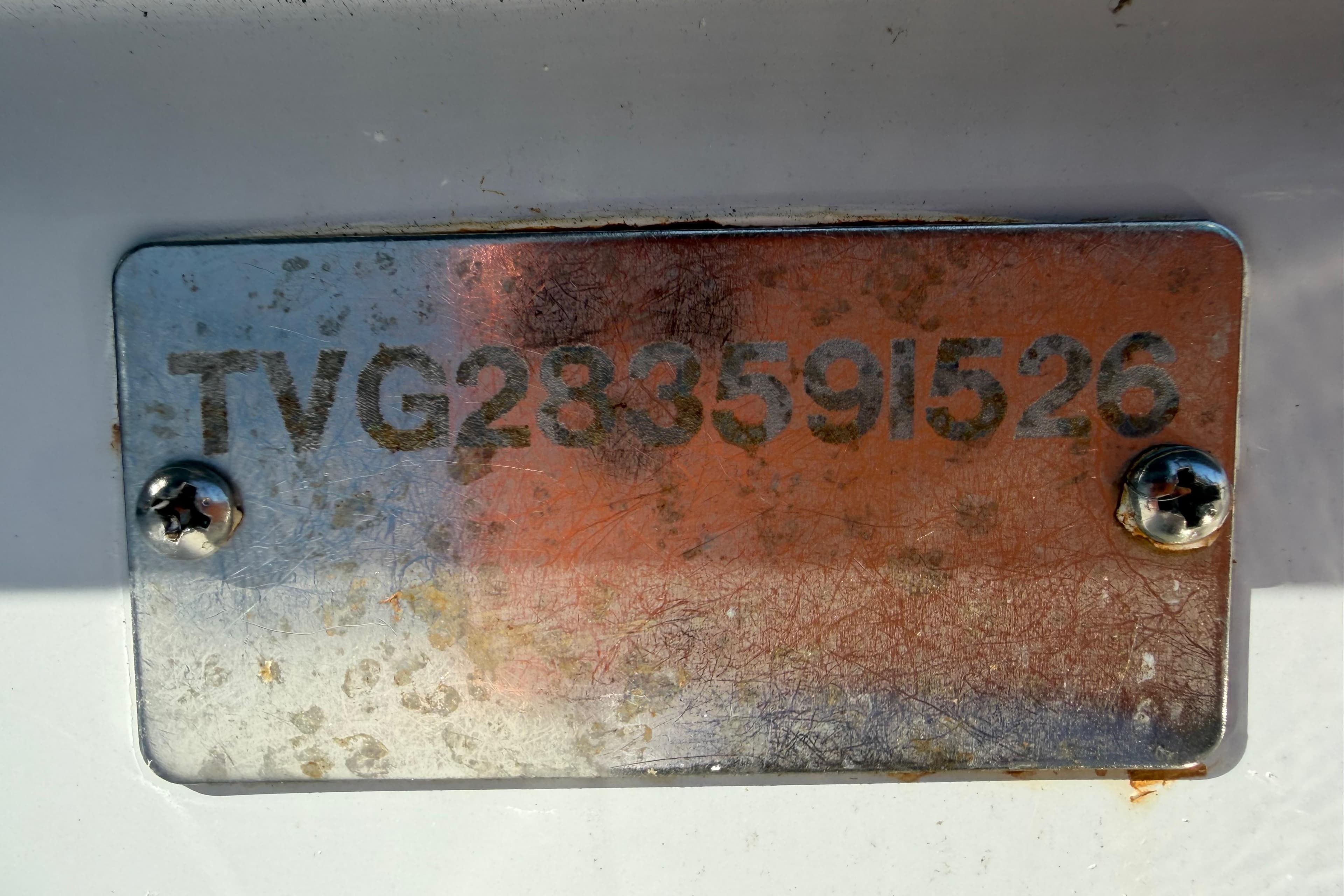 Metallic identification plate on 2026 Twin Vee 280 GFX2 CC boat.