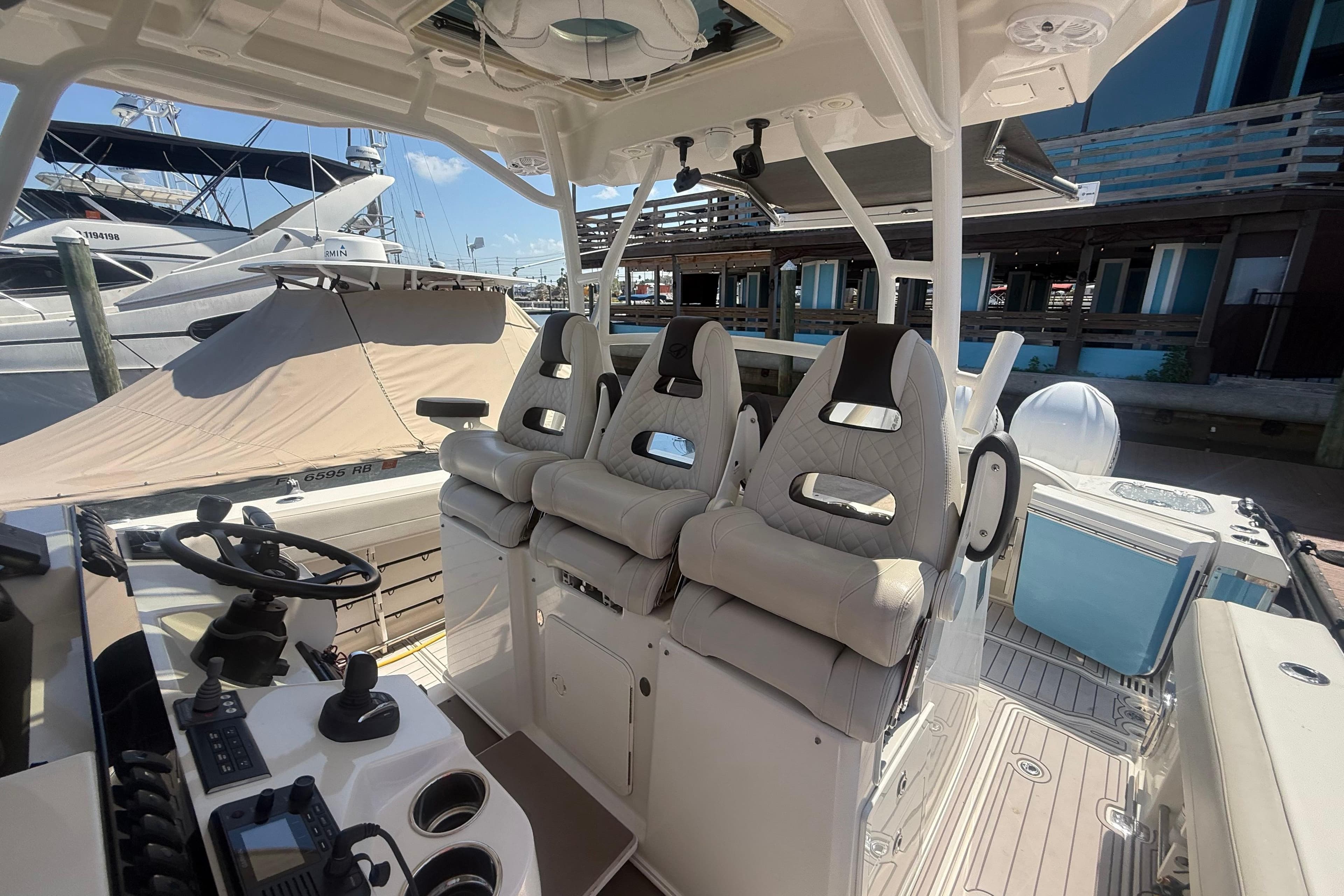 Interior view of 2022 Sailfish 360 CC boat with plush seating and modern controls.