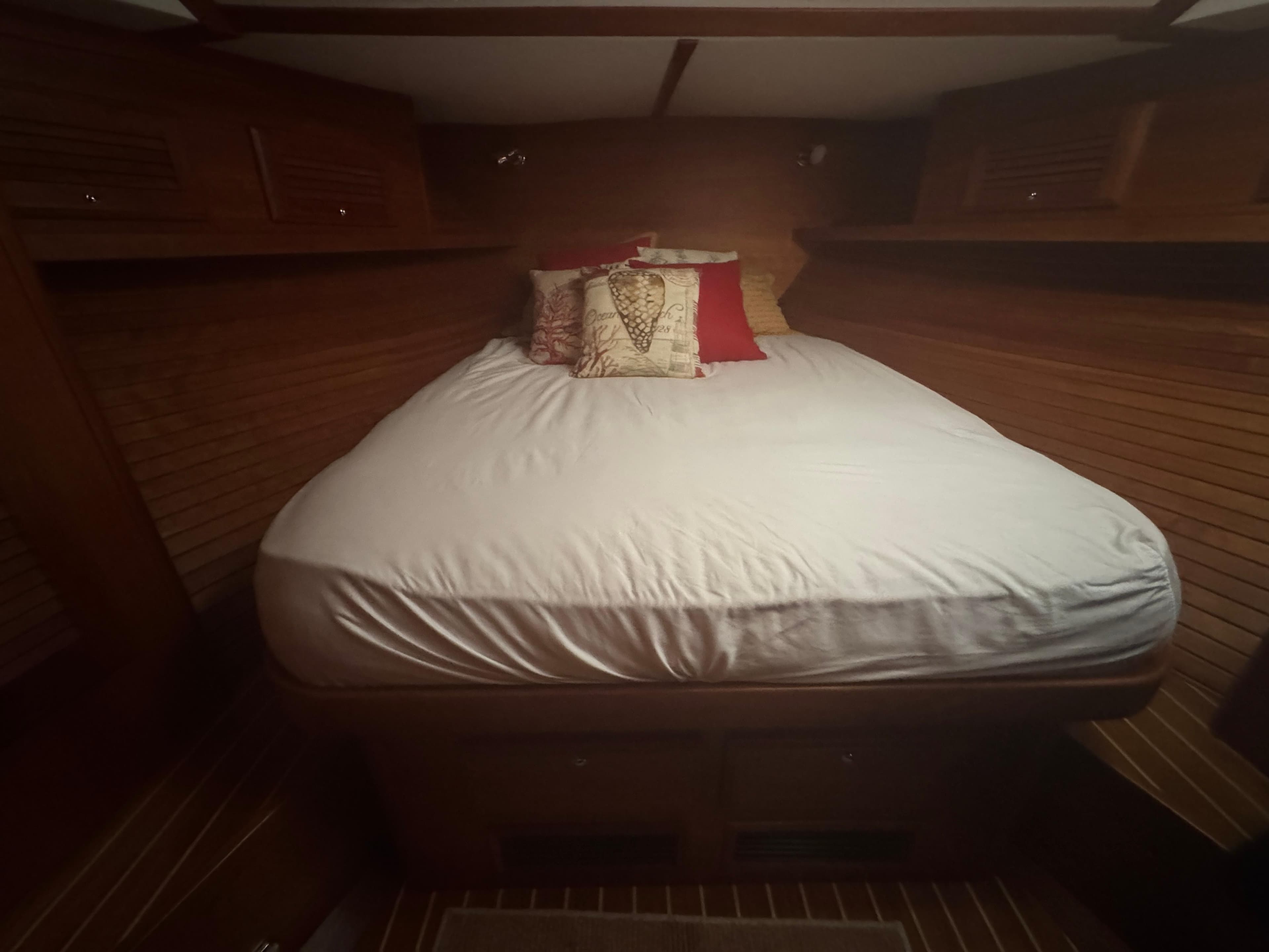 Cozy cabin bedroom in 2008 Sabre 38 Hardtop Express yacht with wooden interior.