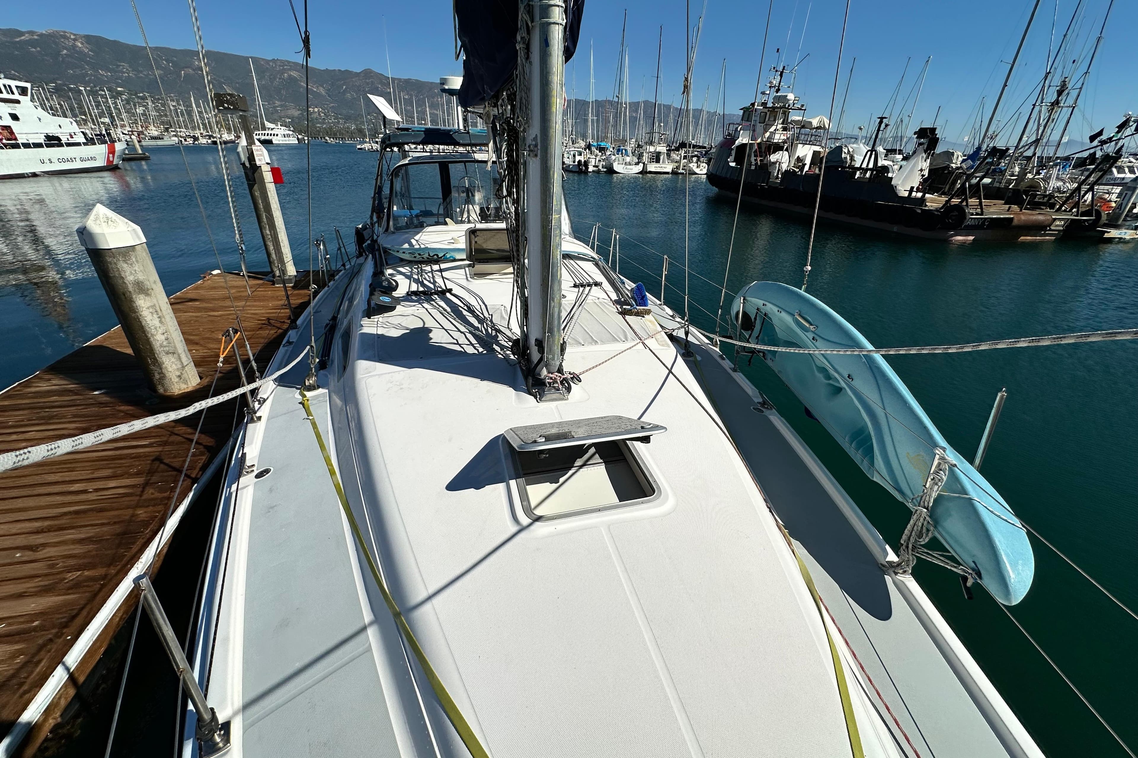 2005 Hunter 41 AC sailboat docked in marina, surrounded by other boats.